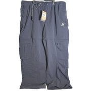 Nike ACG women's convertible zip-off cargo hiking pants in black, size XXL, featuring multiple pockets and adjustable design.