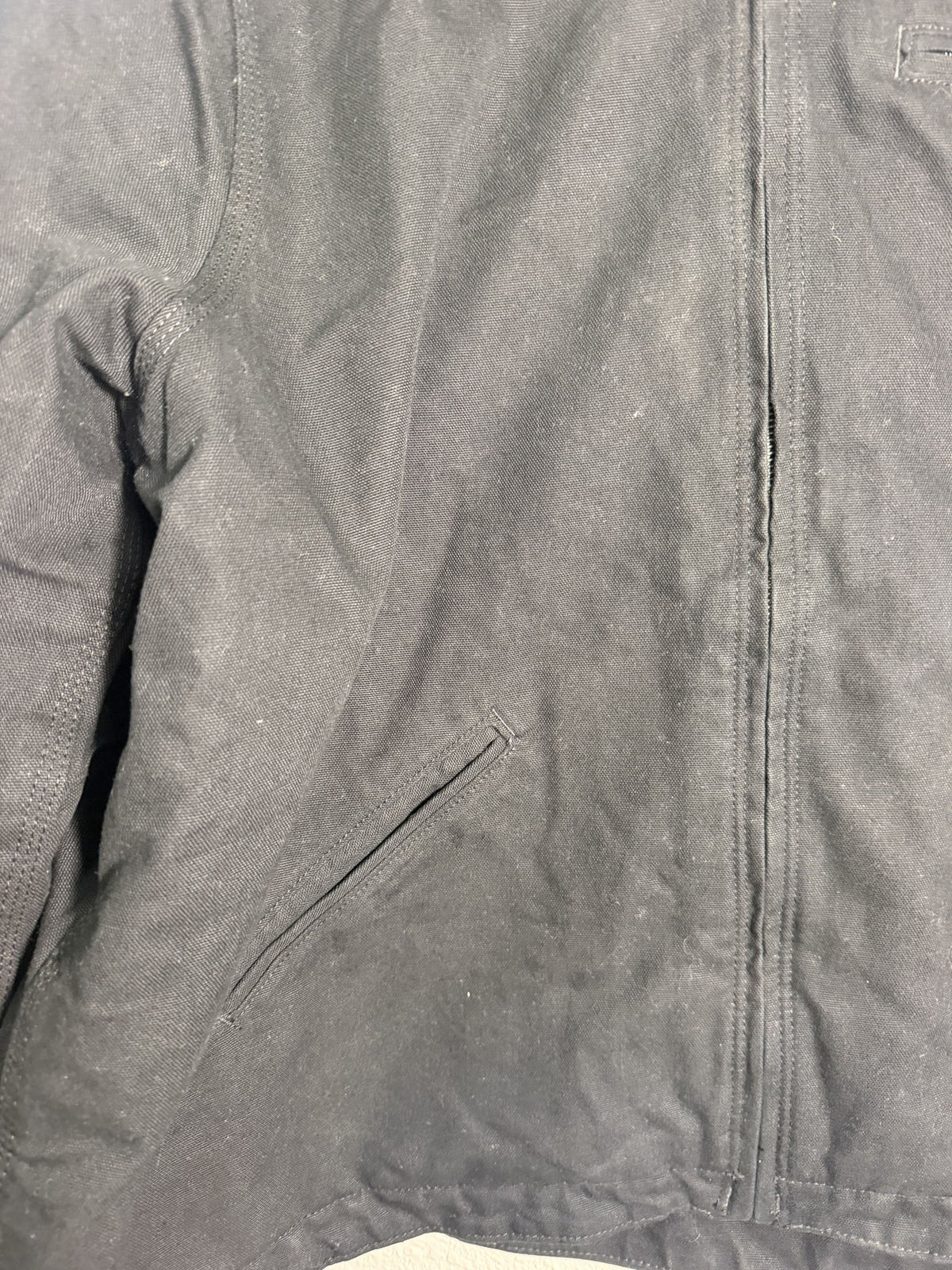 Carhartt women's black loose fit washed duck sherpa-lined hooded jacket, front view showing hood and quilted interior.