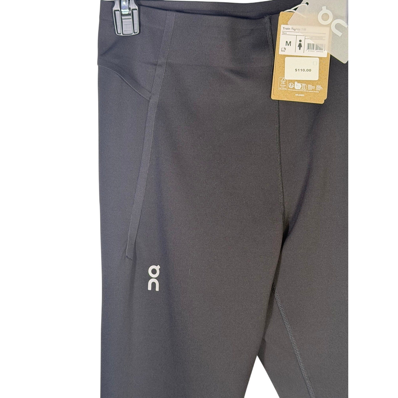 Black On Women’s Train Tights 7/8 leggings size M, showing the fitted athletic design and smooth fabric detail.
