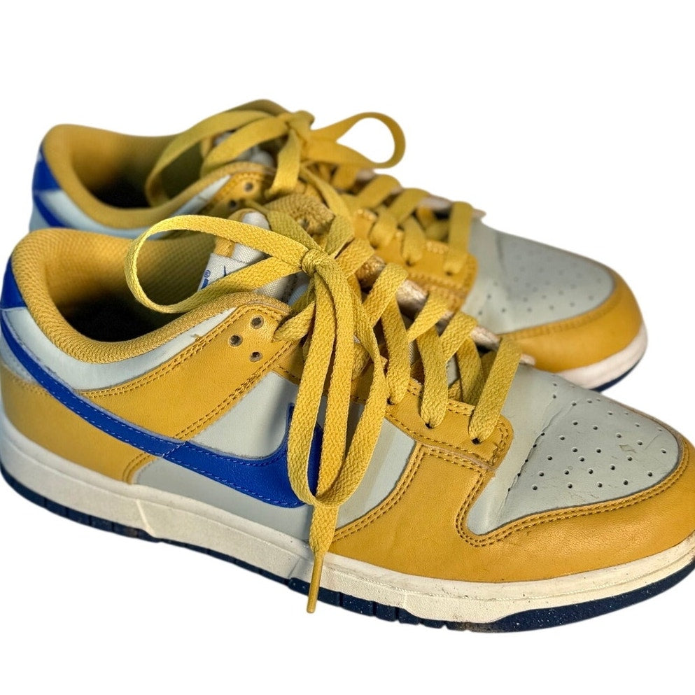 Nike Dunk Low GS sneakers in white leather with University Gold and Game Royal accents, youth size US 6Y.