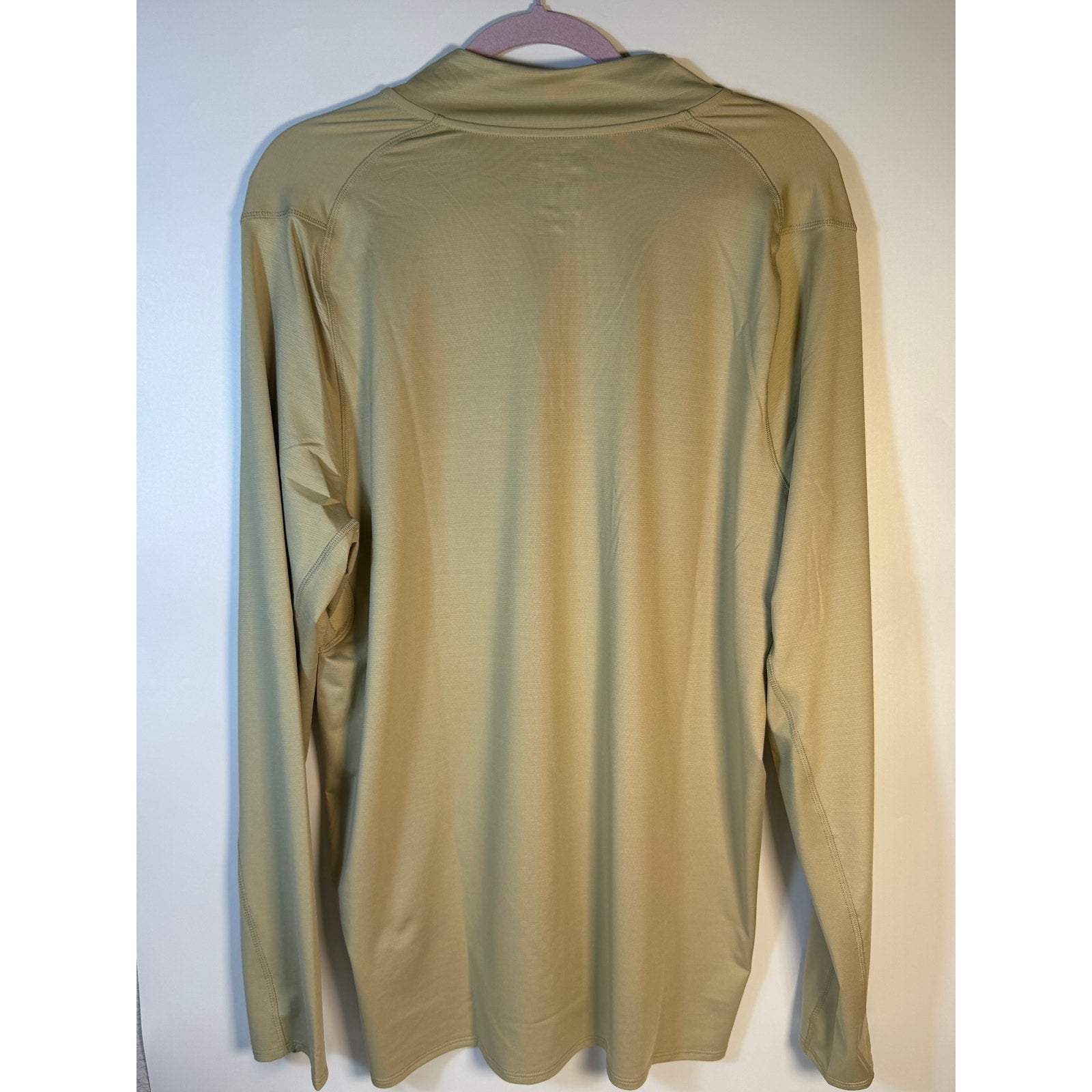 Under Armour Oakley Gravity Range quarter zip pullover in silver sage, XL regular fit, displayed on a hanger.