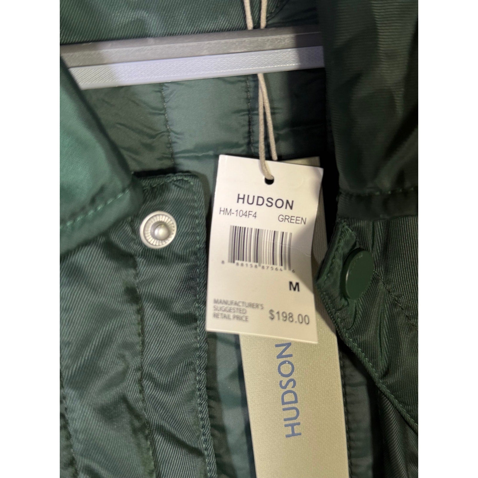 Hudson men's green quilted snap front coat, size medium, with stylish stitching and front snap closure.