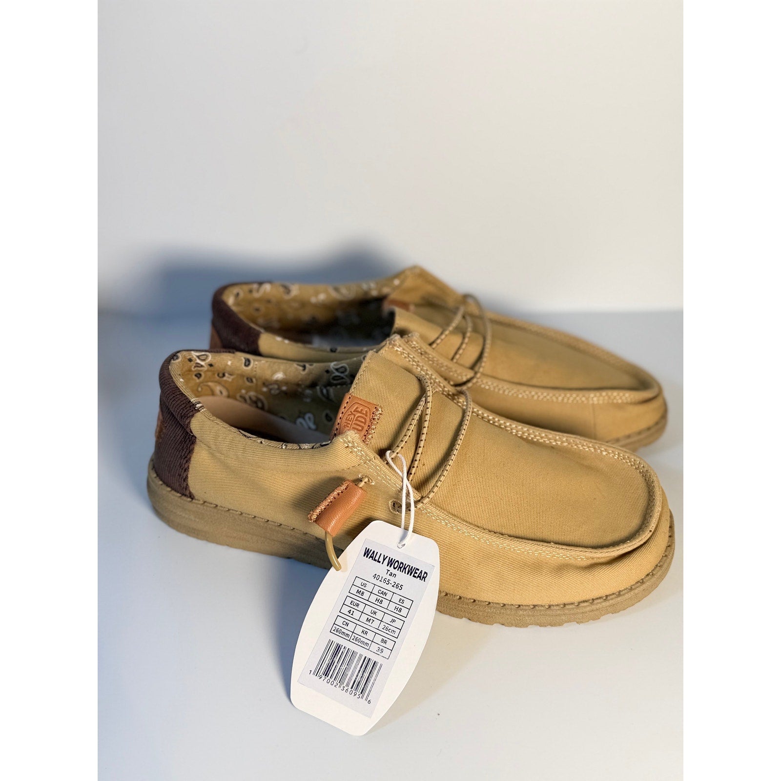 Hey Dude Wally Workwear Tan loafers for men and women, lightweight casual shoes, US size 8 men's / 10 women's, on neutral background.