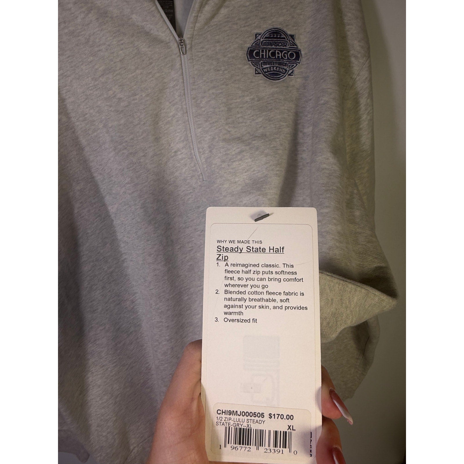 Lululemon Steady State half zip sweatshirt in gray, oversized style, displayed on a hanger, XL size, perfect for casual wear.