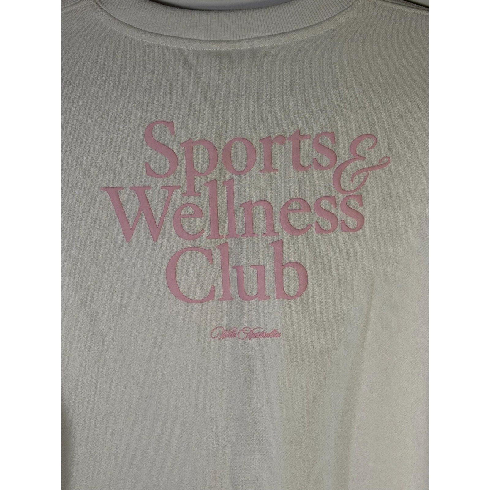 White and pink WILO The Label Sports & Wellness Club crewneck sweatshirt, medium size, with a casual, comfortable fit.