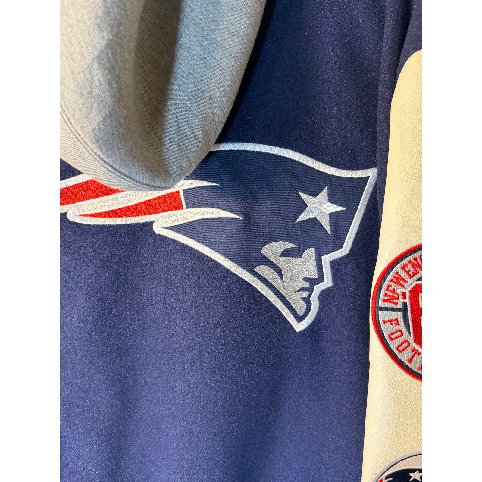 New England Patriots women's varsity hoodie in blue and white with embroidered team logo, faux leather accents, size XL, NFL team apparel