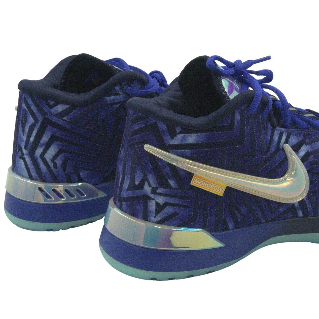 Nike Monopoly X Zoom LeBron NXXT Genesis basketball shoes in Persian Violet, men's size 11, featuring Nike branding and vibrant design.