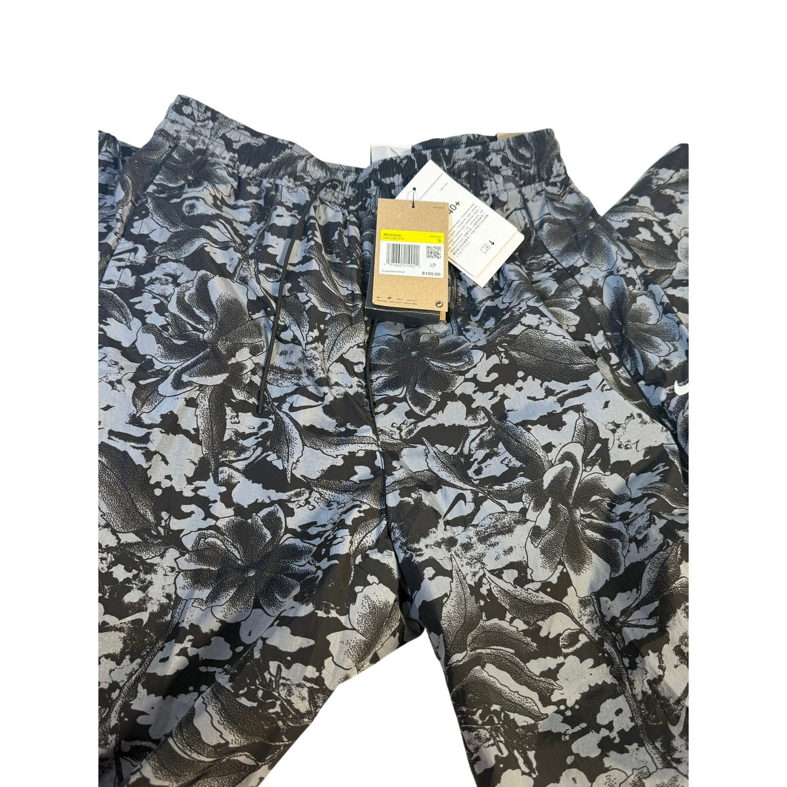 Nike Dri-FIT ADV women's running shorts in black and gray floral print, size small, with lightweight, breathable fabric.