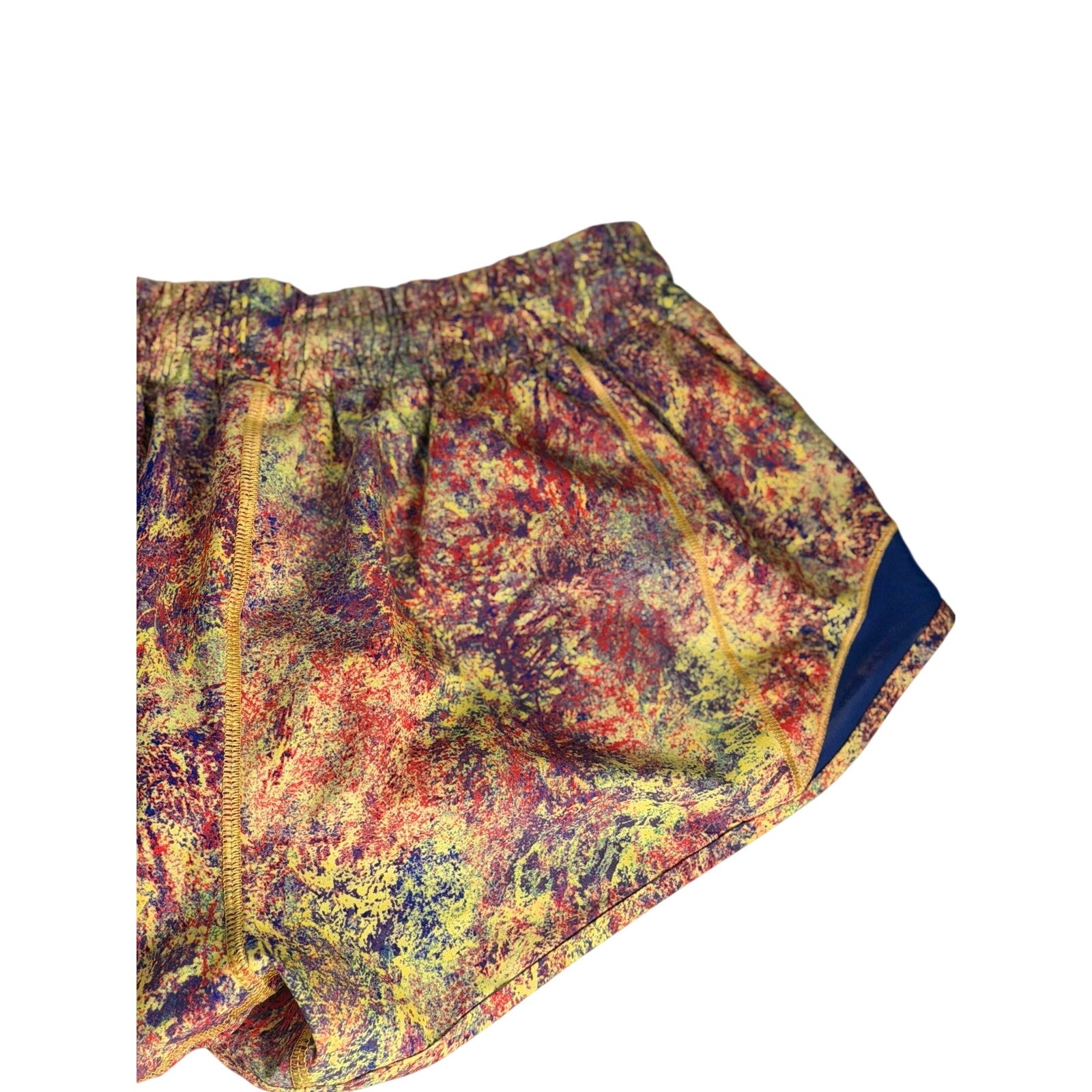 Lululemon women’s printed running shorts in multicolor navy with a size 6, featuring a lightweight design and vibrant pattern.