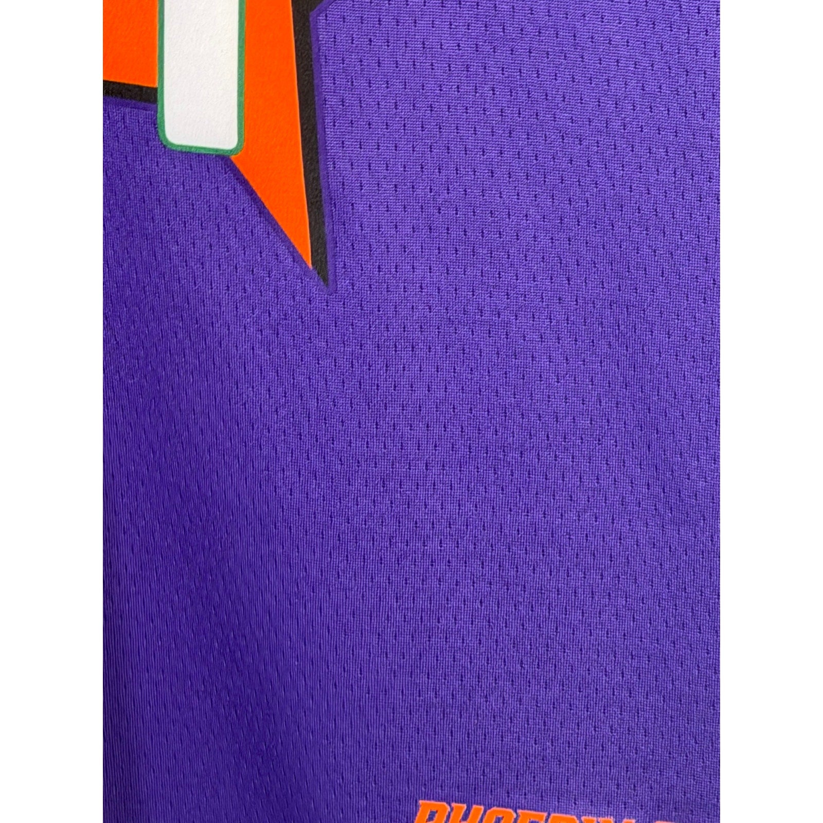 Nike Phoenix Suns Devin Booker #1 youth purple basketball jersey, size L 14/16, with team logo and player name.