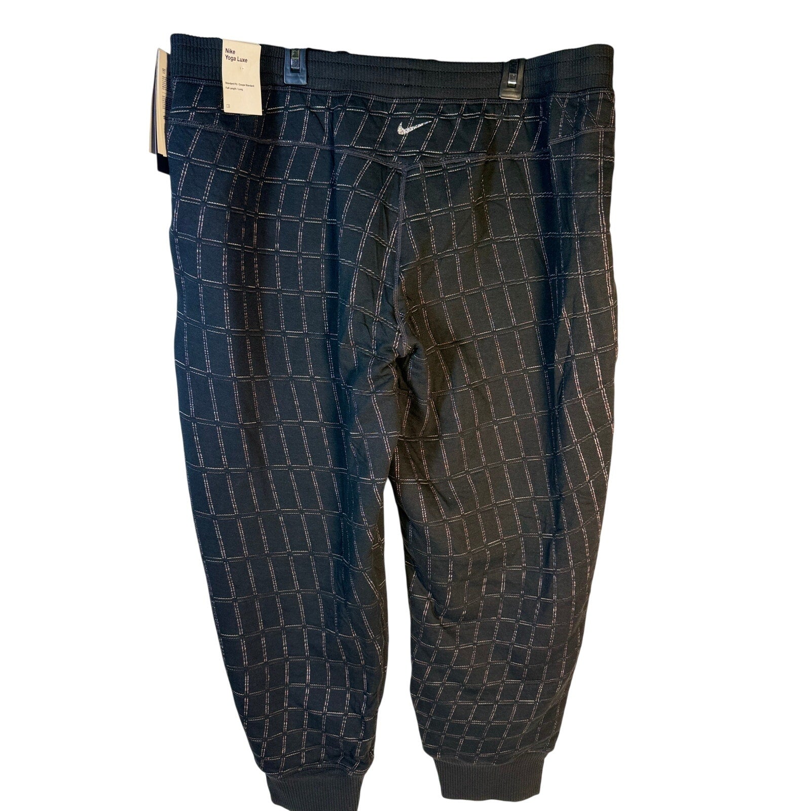 Nike Women's black Yoga Luxe Grid Print Jogger Pants, XL size, with comfortable fit and stylish athletic design.