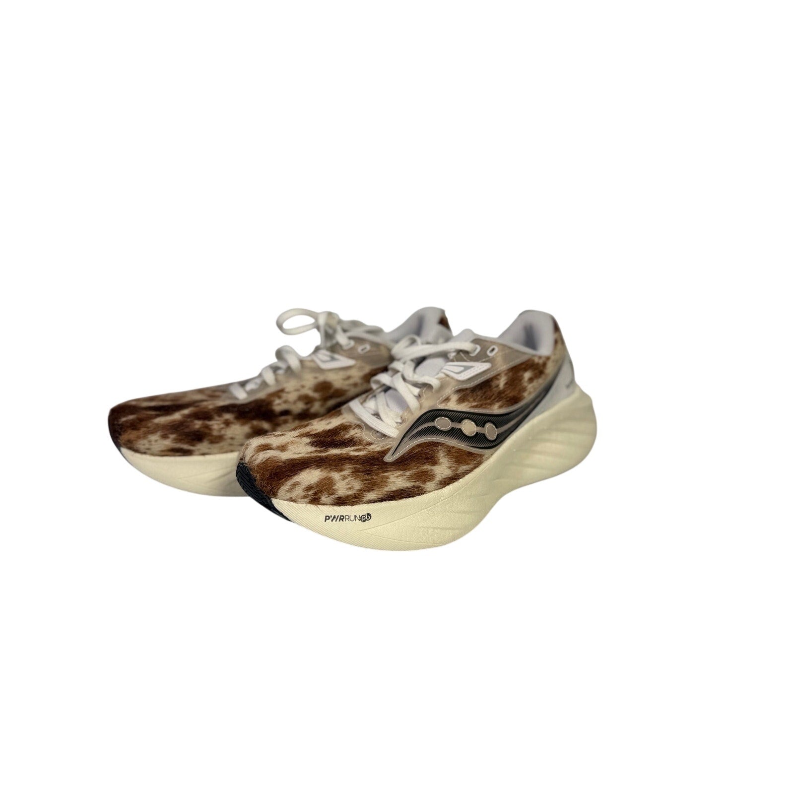 Saucony Women’s Endorphin Shift 3 Runshield cow print athletic running shoes, size 9, with waterproof design and cushioned sole.