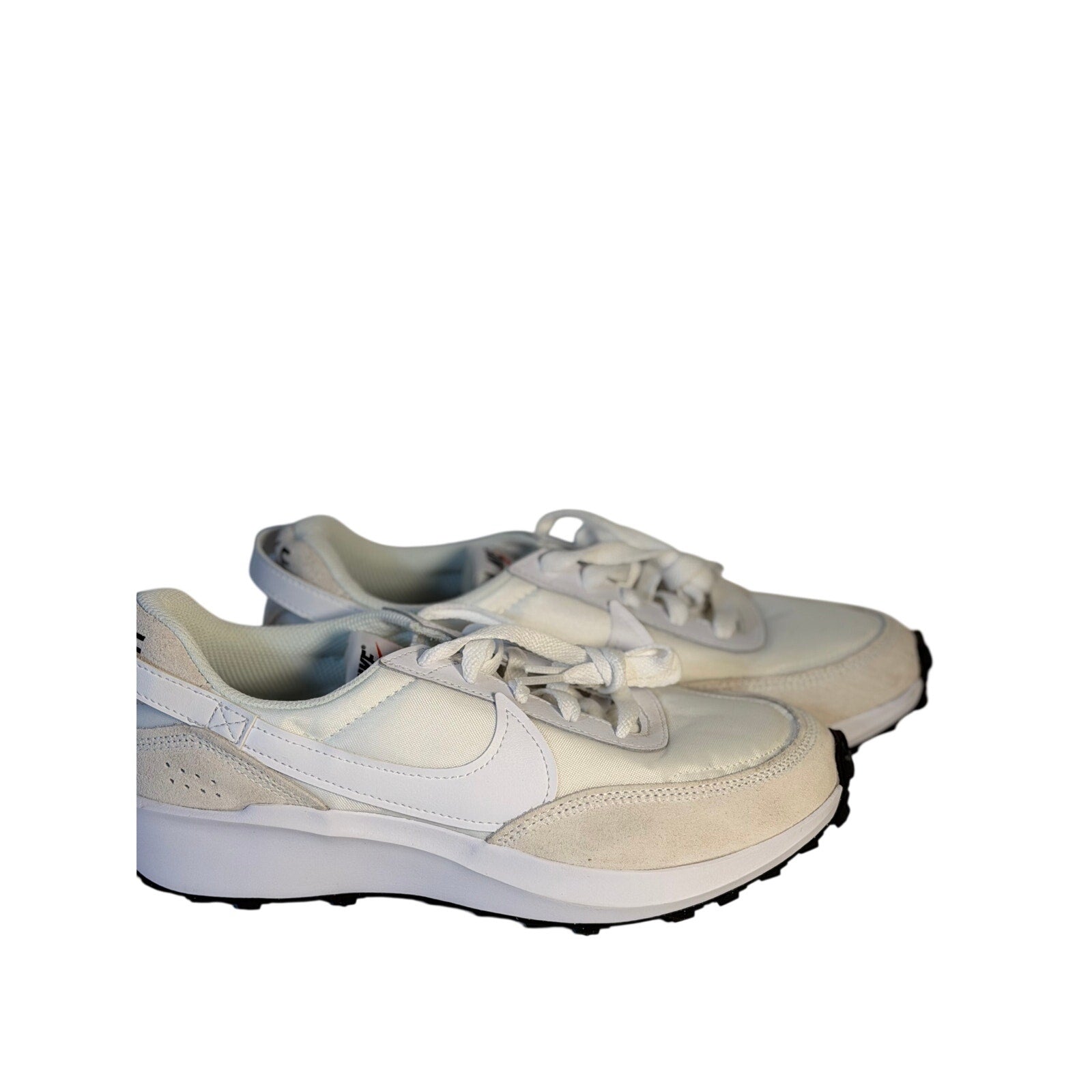 Nike Waffle Debut women's sneakers in size 9.5, featuring a classic design with white and black colorway and textured rubber outsole.