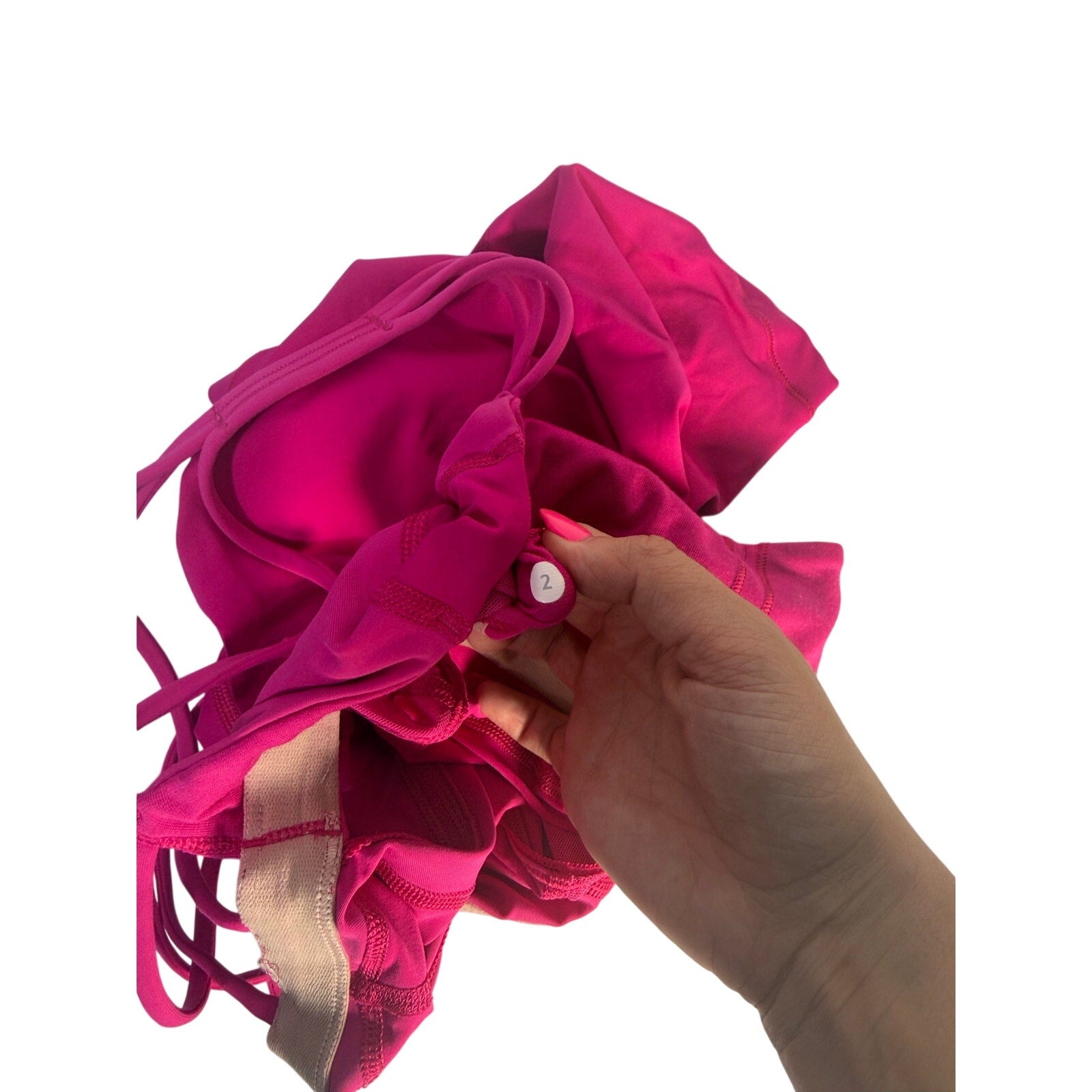 Lululemon women's magenta strappy cutout athletic tank top, size 2, pre-owned, featuring a fitted design and breathable fabric.