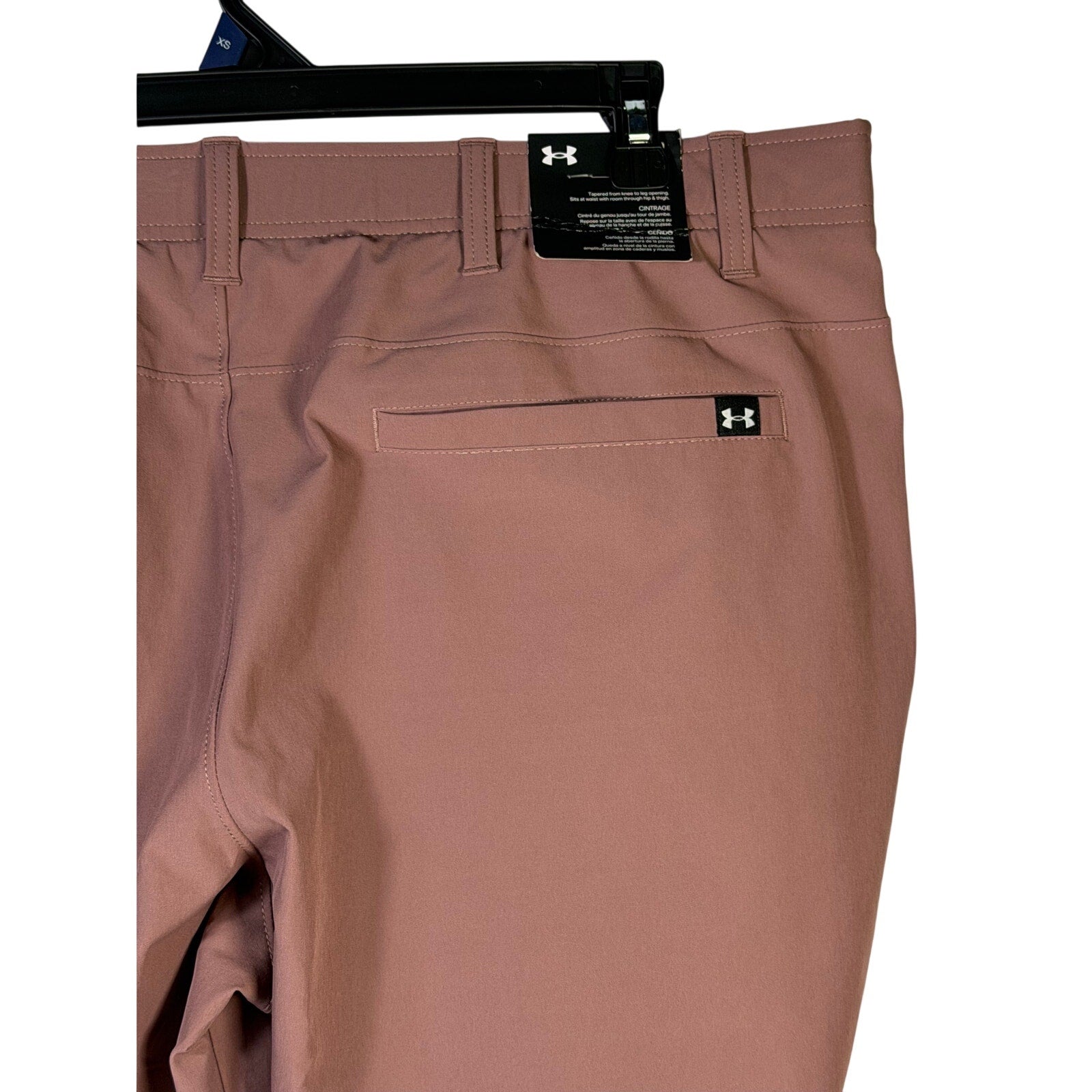 Under Armour UA Drive Tapered Golf Pants for men, maroon mist color, size 42x30, shown flat with waistband and tapered legs.