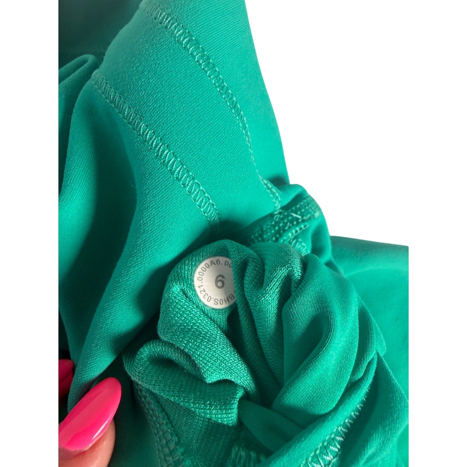 Lululemon women's teal green high-rise biker shorts in size 6, made of stretchy athletic fabric, fitted style for activewear.