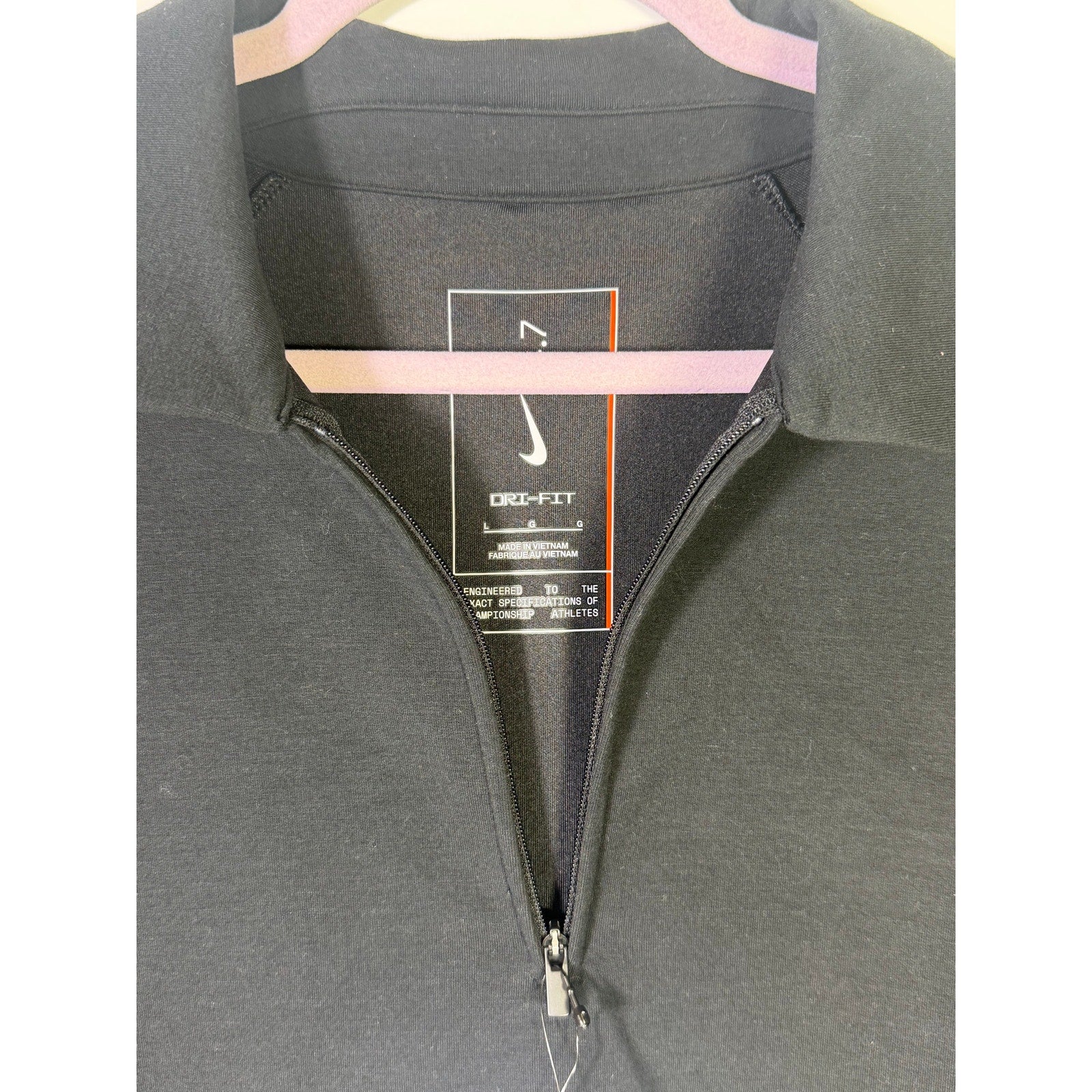 Nike Dri-FIT men's black 1/4 zip golf polo shirt, short sleeve, size L, new with tags, shown on a plain background.