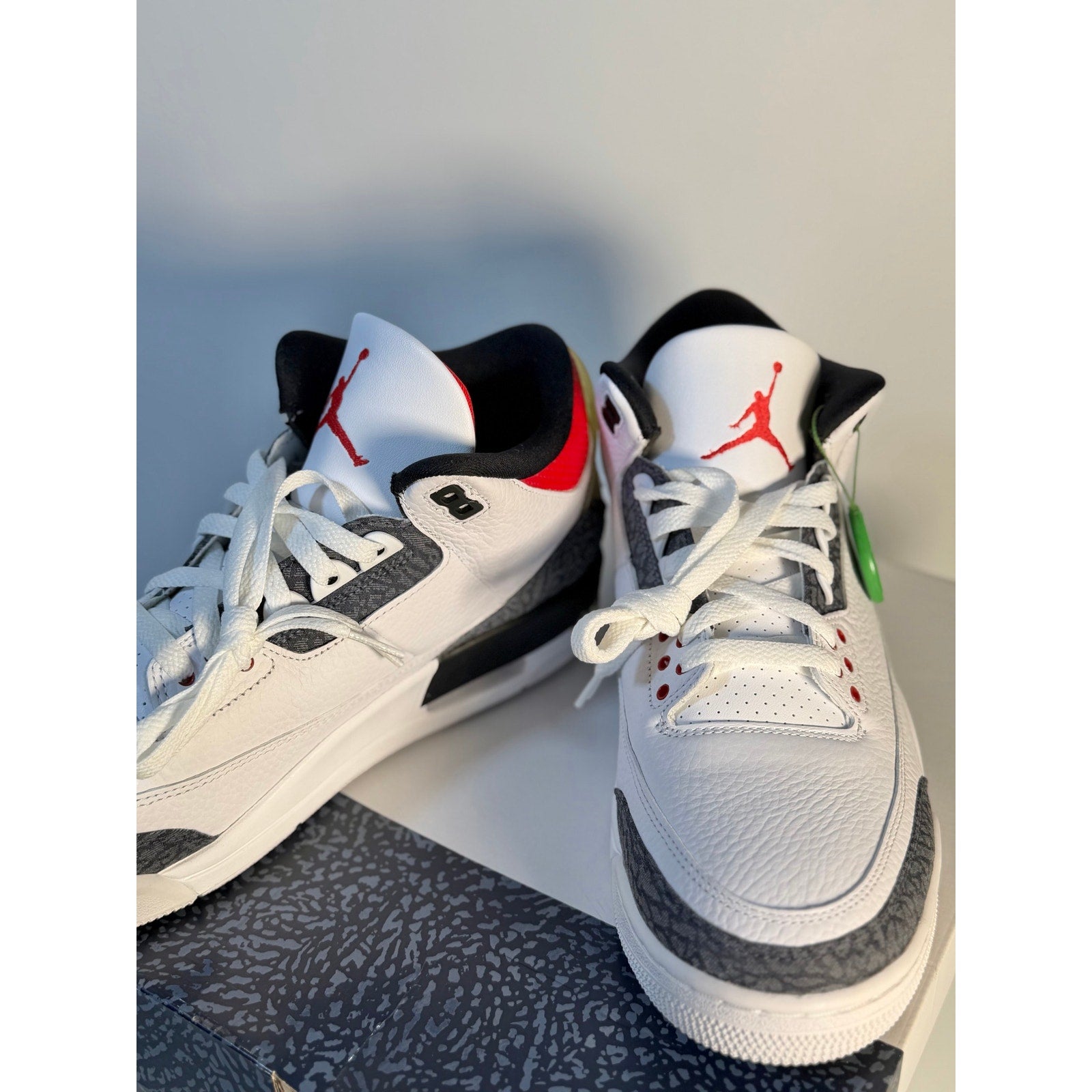 White and grey Air Jordan 3 Retro athletic sneakers for men, featuring the iconic cement print and Jordan branding.