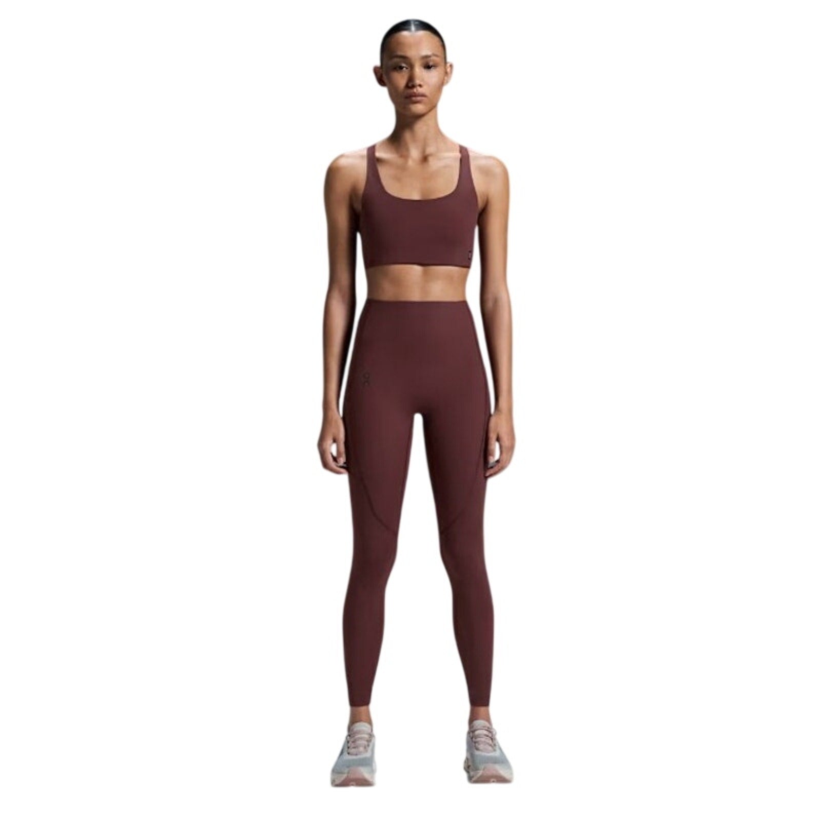 On Cloud Women’s Movement Tights in Mulberry, XS long leggings with a sleek, fitted design, shown on a model.