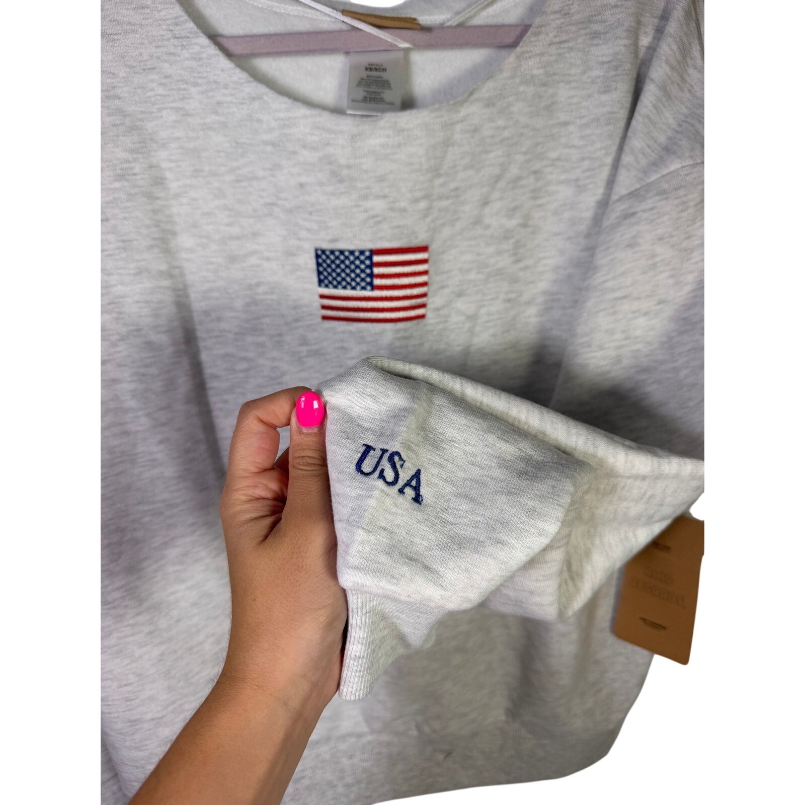 Kind Regard women's crewneck sweatshirt with American flag embroidery, size XS, casual American-themed apparel.