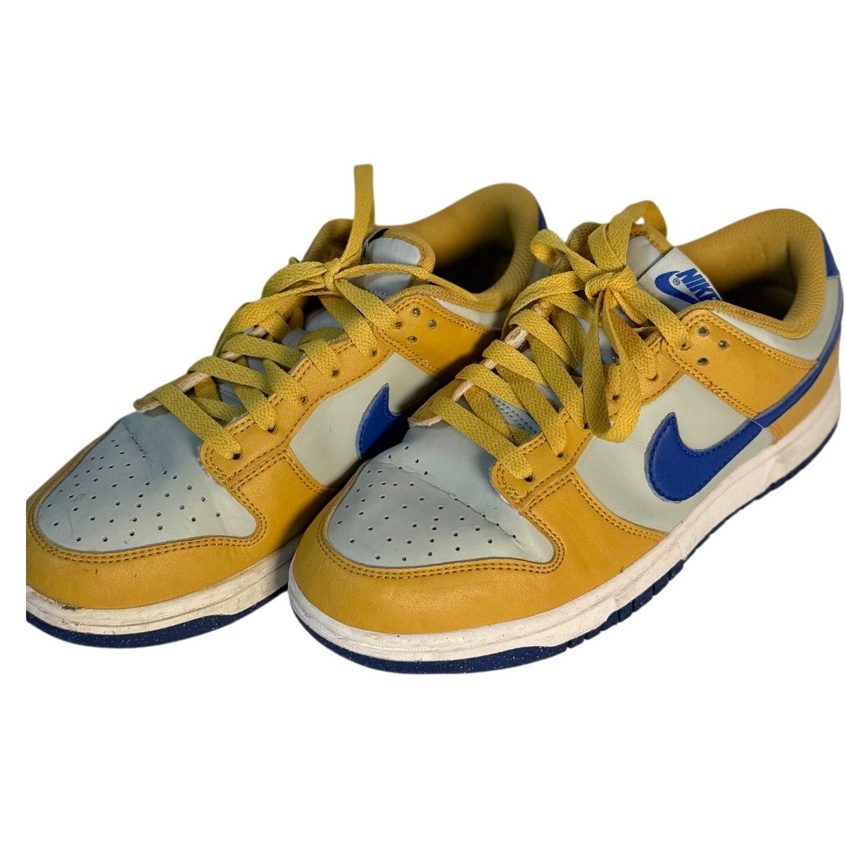 Nike Dunk Low GS sneakers in University Gold, Game Royal, and White leather for youth. Youth size US 6Y, Nike brand.