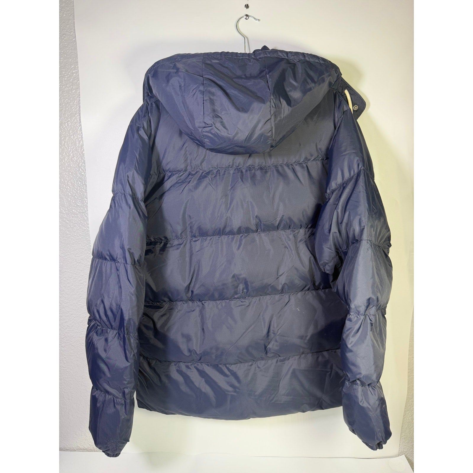 Alpine Design men's AD 1962 hooded puffer jacket in deep navy, size L, showing front view with hood and quilted design.