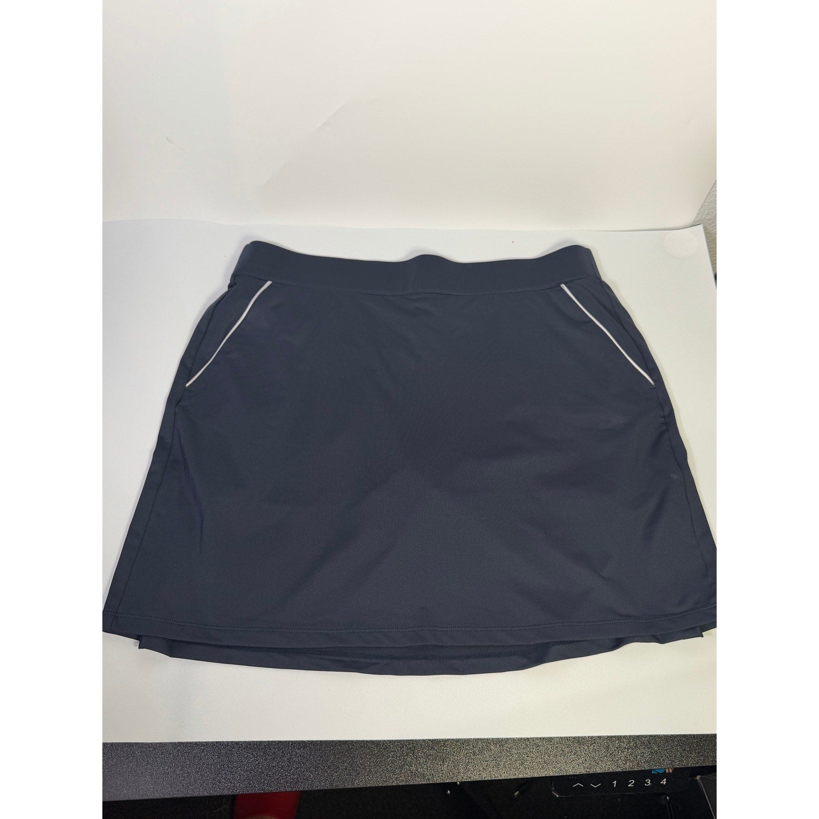 Dunning women's navy golf skort with built-in shorts, athletic style, size large, suitable for sports or casual wear.