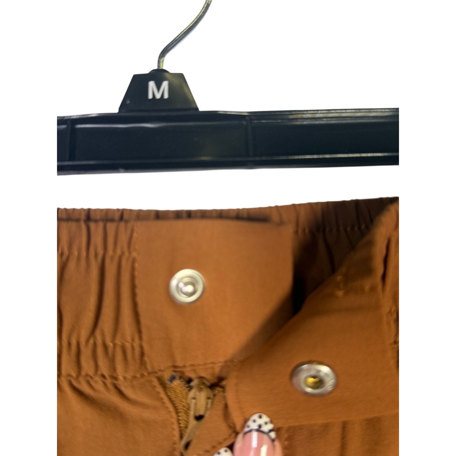 Nike Sportswear men's woven pants in brown cacao with elastic waist, size XXL, new with tags, front view.