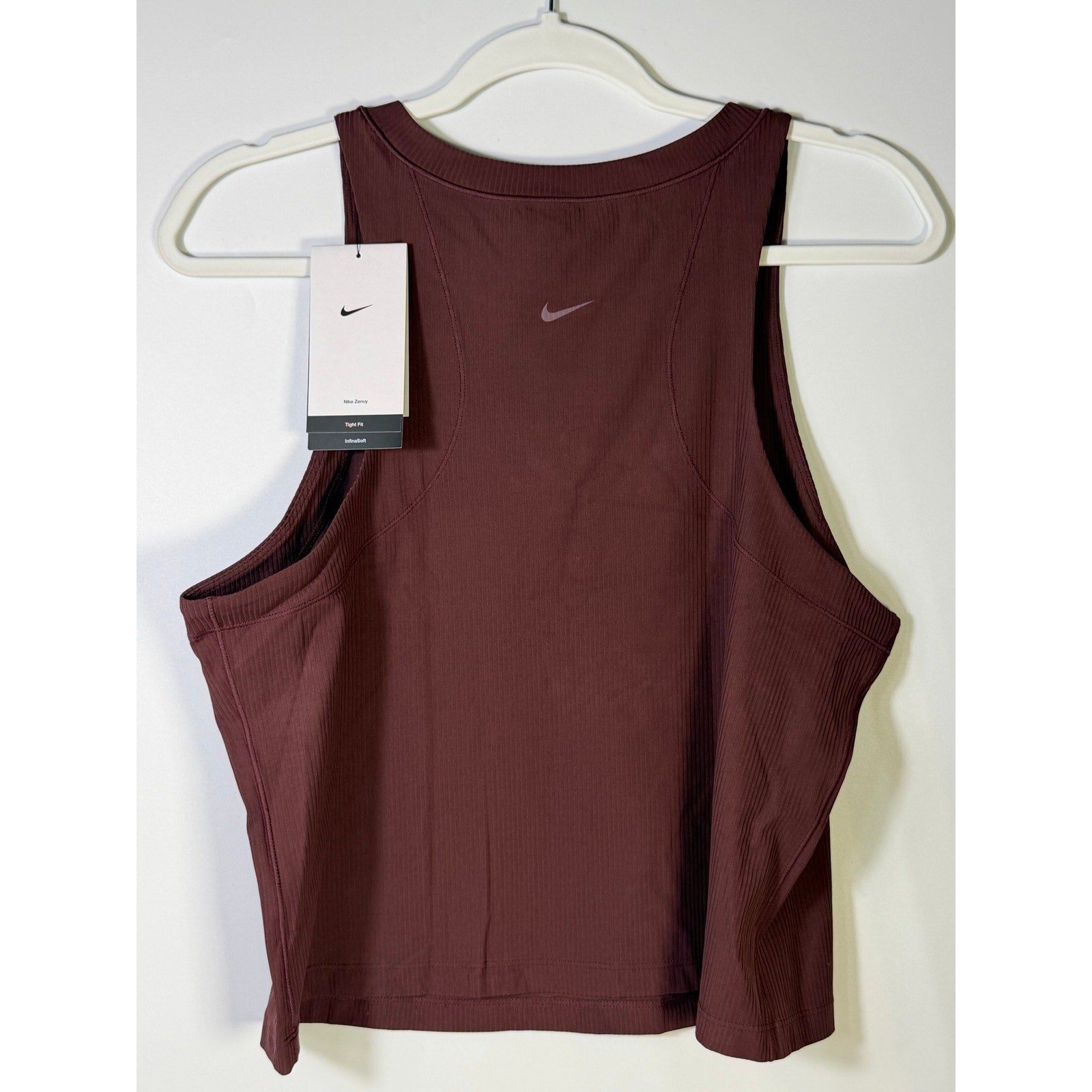 Nike women's ribbed brown cropped muscle tank top, size L, showing the fitted sleeveless design and ribbed fabric detail.