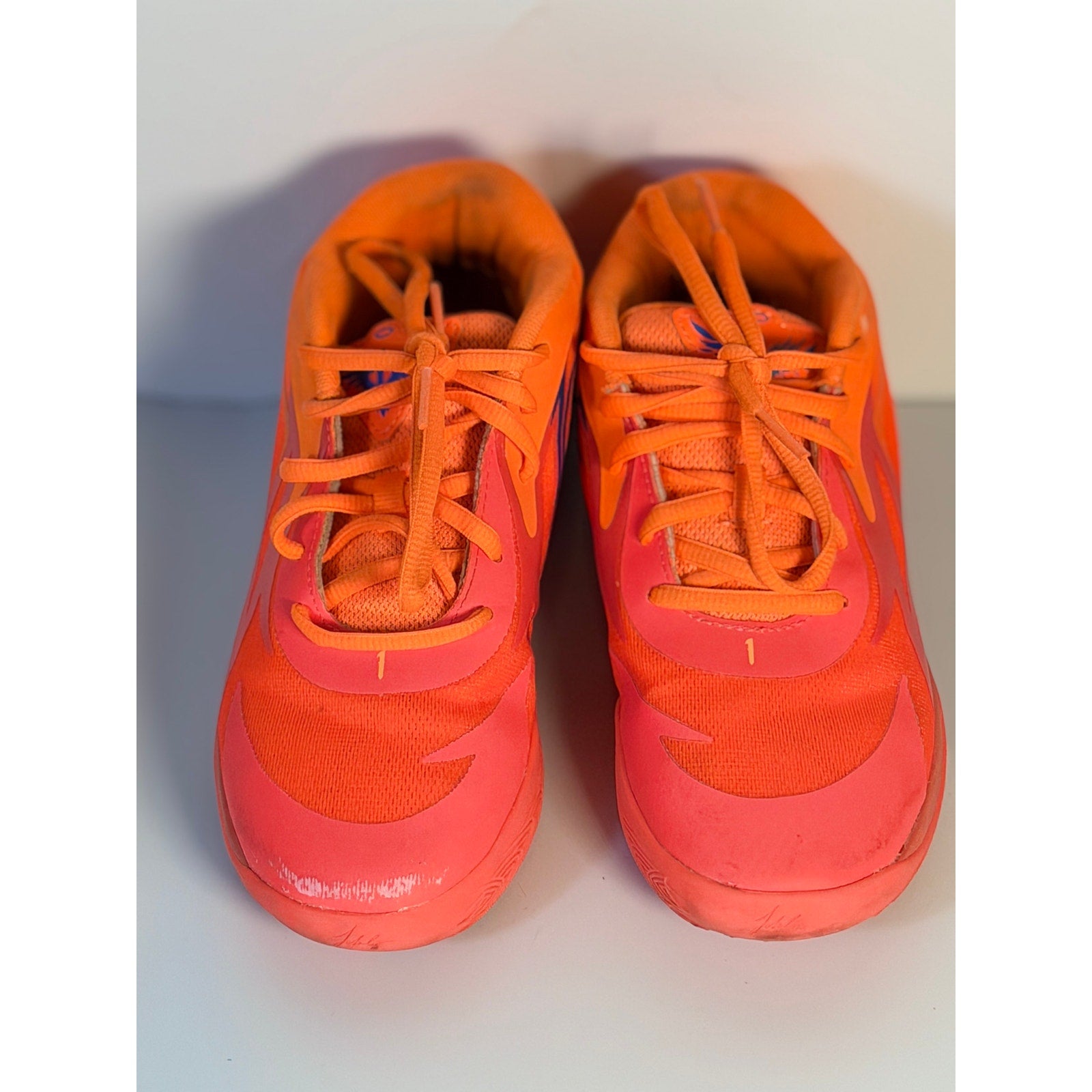 PUMA MB.02 Lo basketball shoes in orange and pink for men, size 5.5, athletic sneakers with sporty design and breathable material.