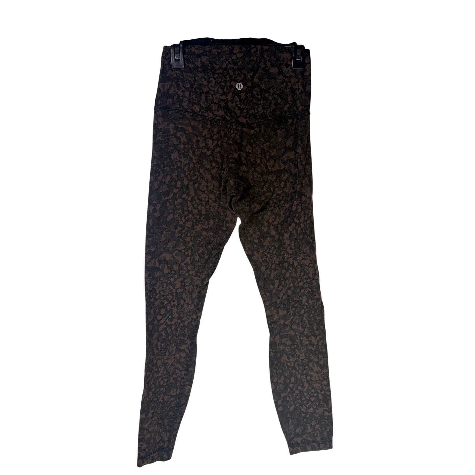 Lululemon women’s Align high-rise leggings in brown and black camouflage, 25-inch length, size 4, with flexible, comfortable fabric.
