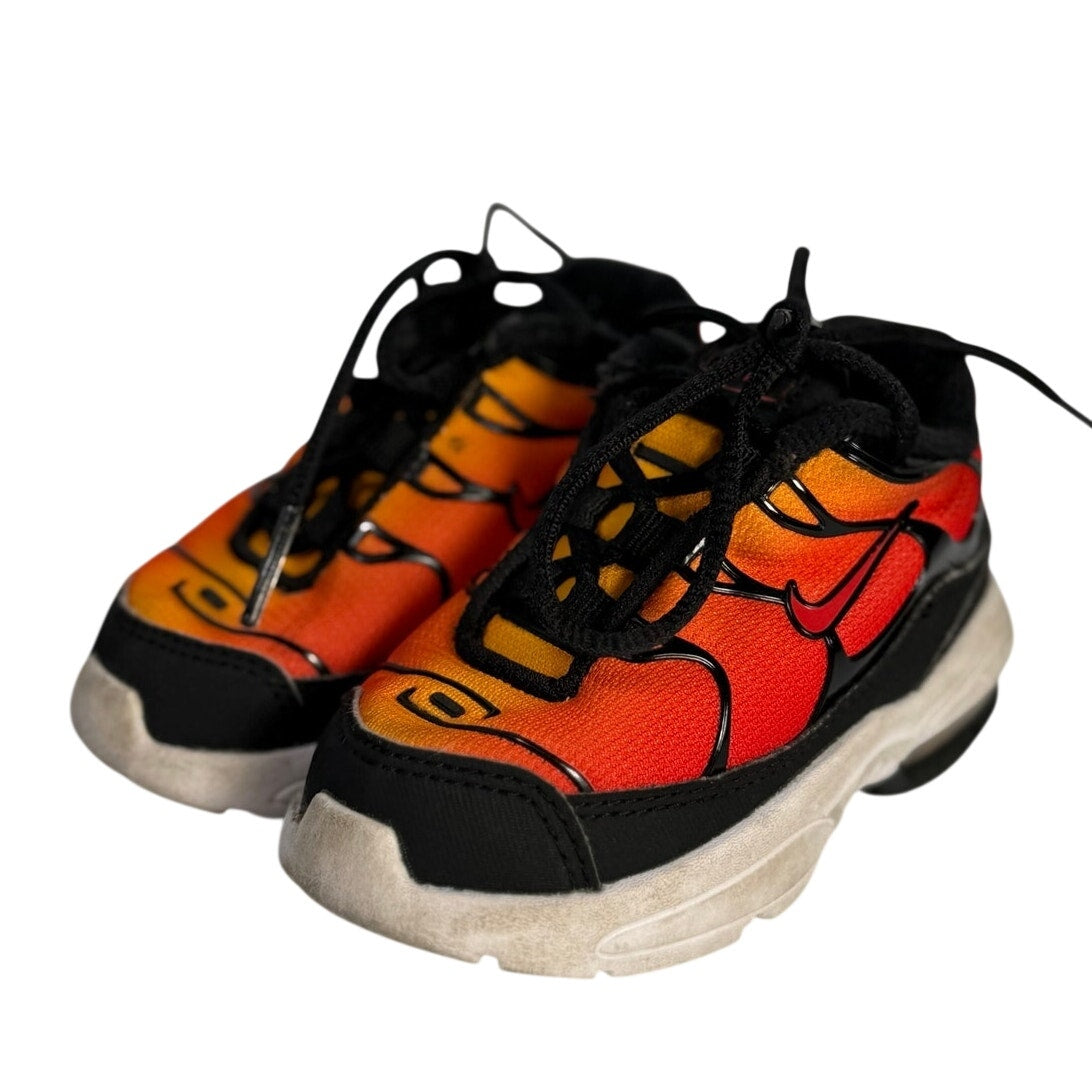 Pre-owned Nike Air Max athletic sneakers in orange, red, and black with lace-up design, size 5C.