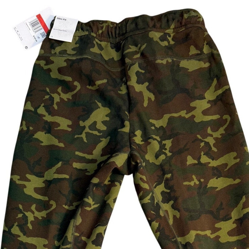 Nike Sportswear Tech Camo Jogger Pants in youth large, slim fit, with camouflage pattern and tapered leg design.