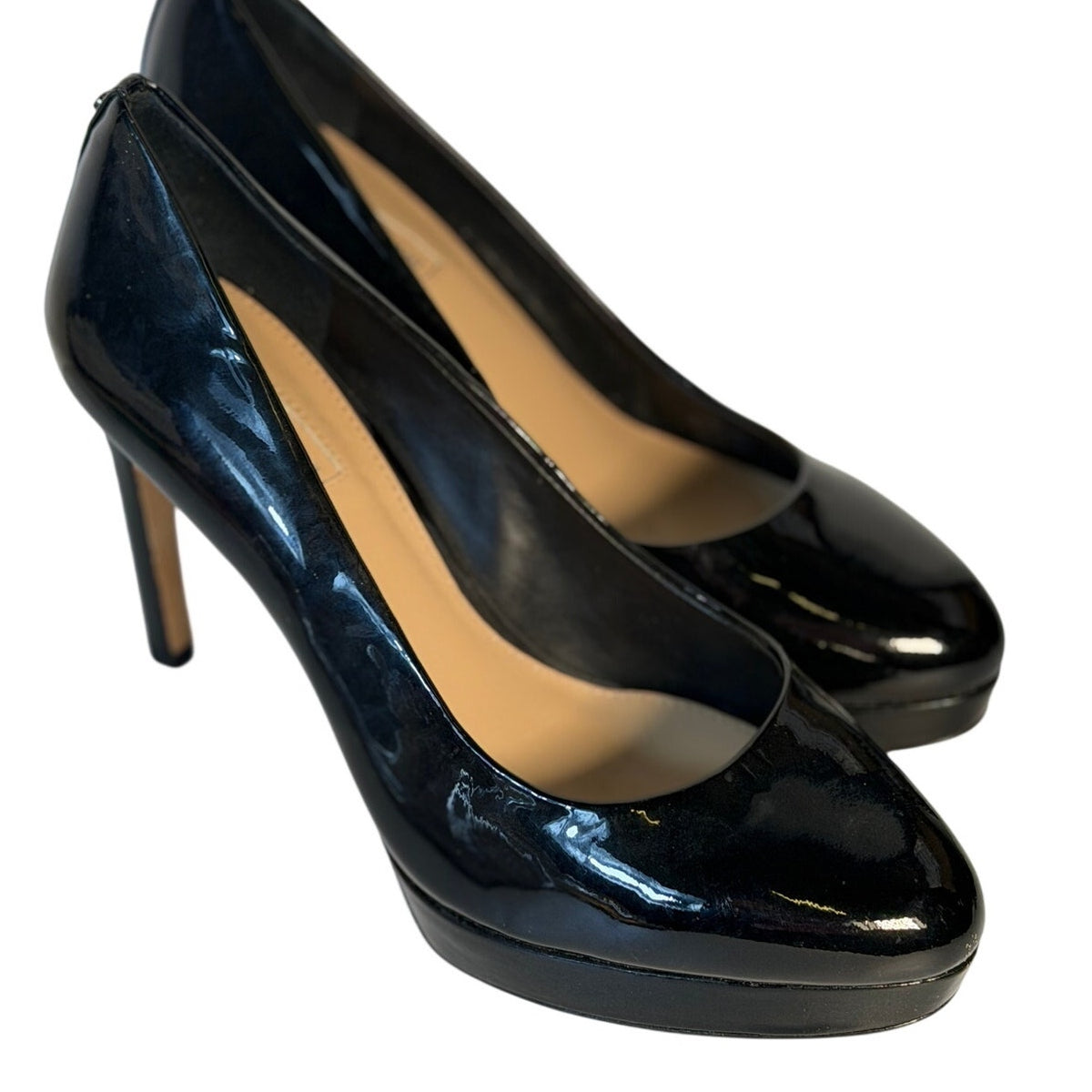 Black patent leather Antonio Melani women's high heel pumps in size 9M with a classic pointed toe design.