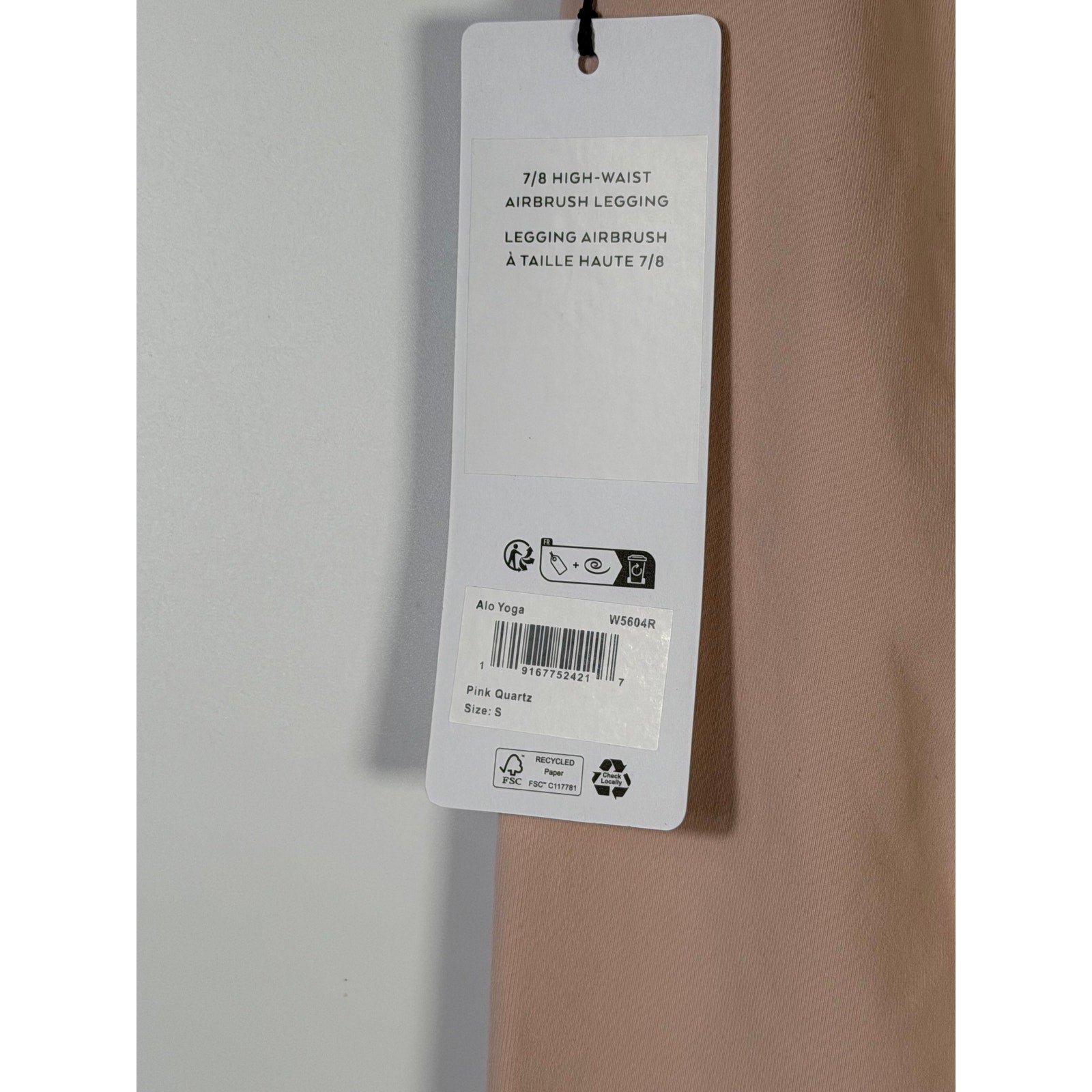 Alo Yoga 7/8 high waist Airbrush leggings in pink quartz, women's small size, showing the snug fit and smooth fabric.