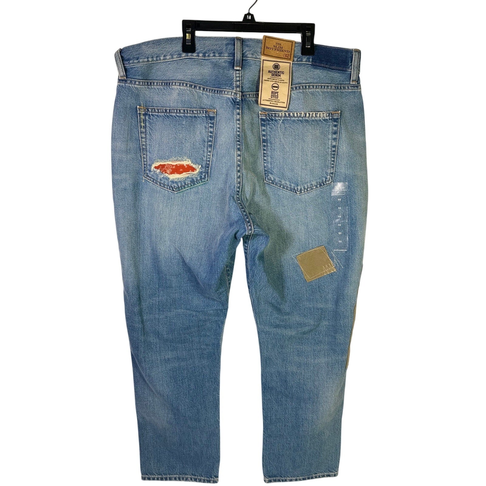 Polo Ralph Lauren men's slim boyfriend patchwork distressed jeans in size 32, showing front view with faded, ripped details.