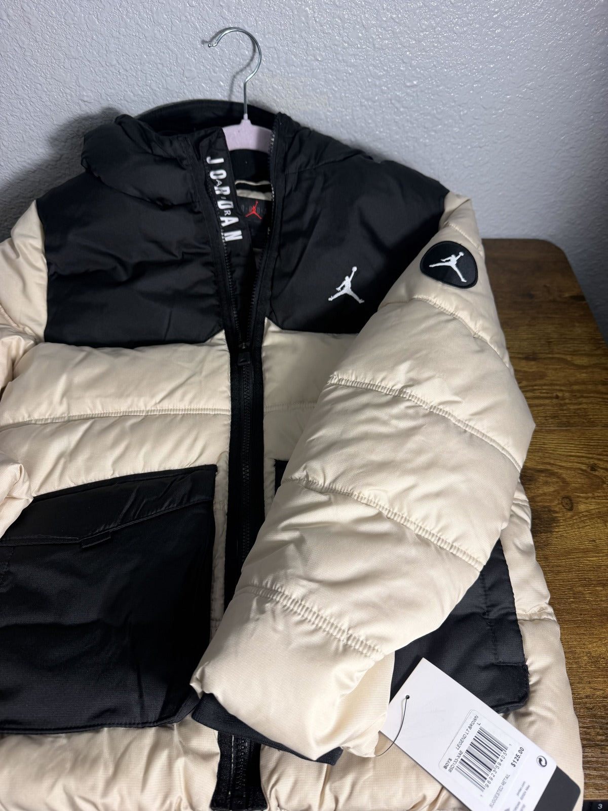Jordan Jumpman hooded puffer jacket for boys in Legend Light Brown and Black, featuring quilted design and sporty style.