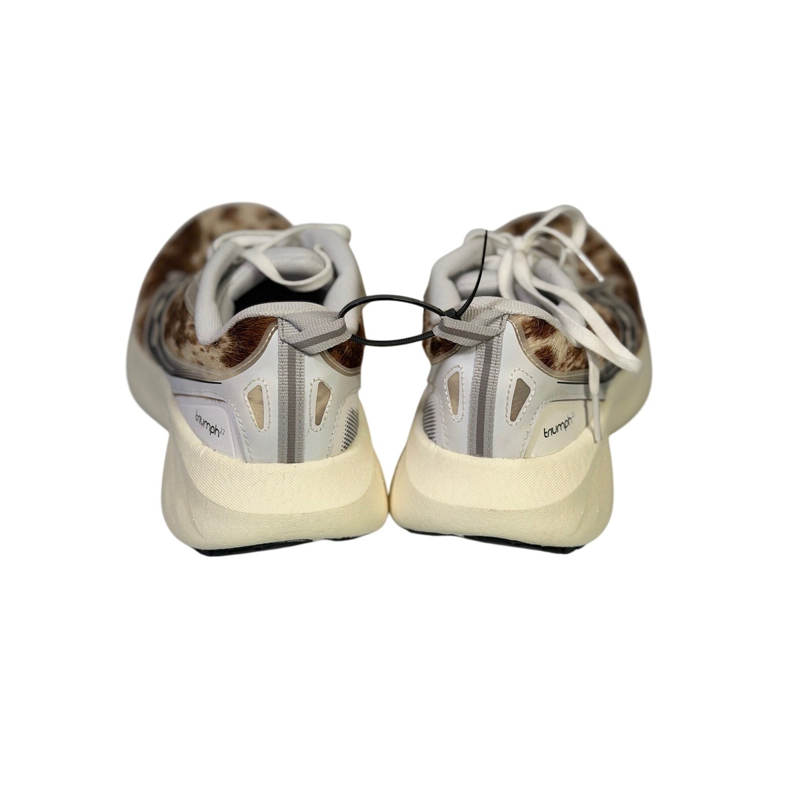 Saucony women's Endorphin Shift 3 Runshield athletic shoes with cow print design, size 9, lightweight running footwear.