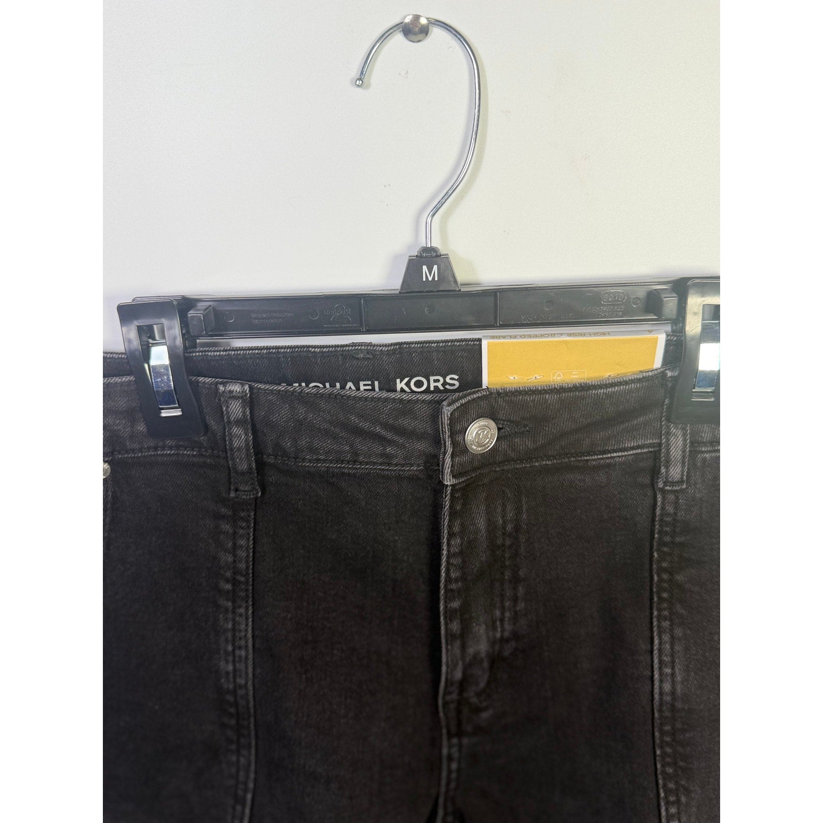 Michael Kors women's cropped flare jeans in washed black, size 4, with a fitted waistband and stylish flared leg.
