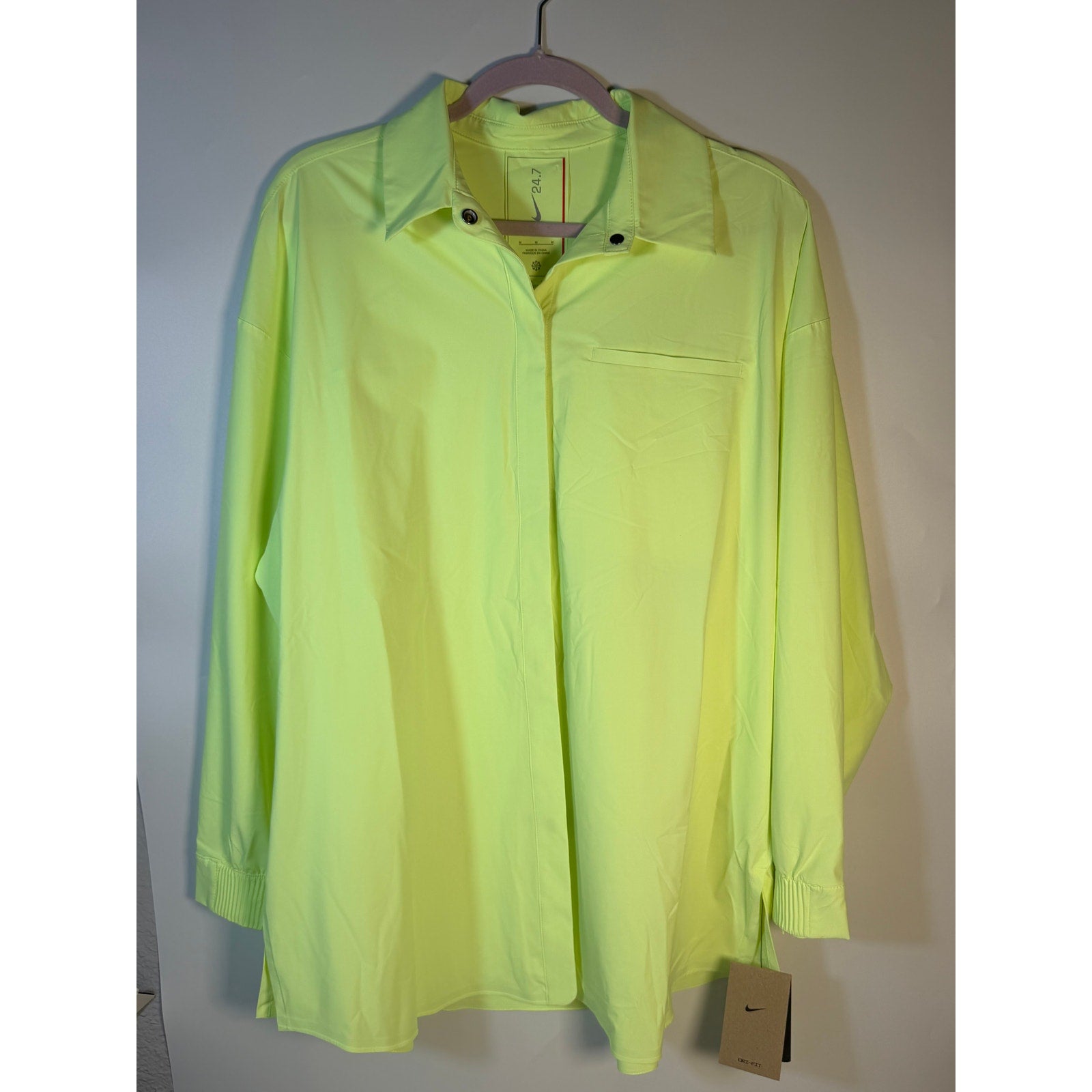 Nike 24.7 Dri-FIT women's long sleeve training shirt in neon yellow, medium, with moisture-wicking fabric and athletic fit.