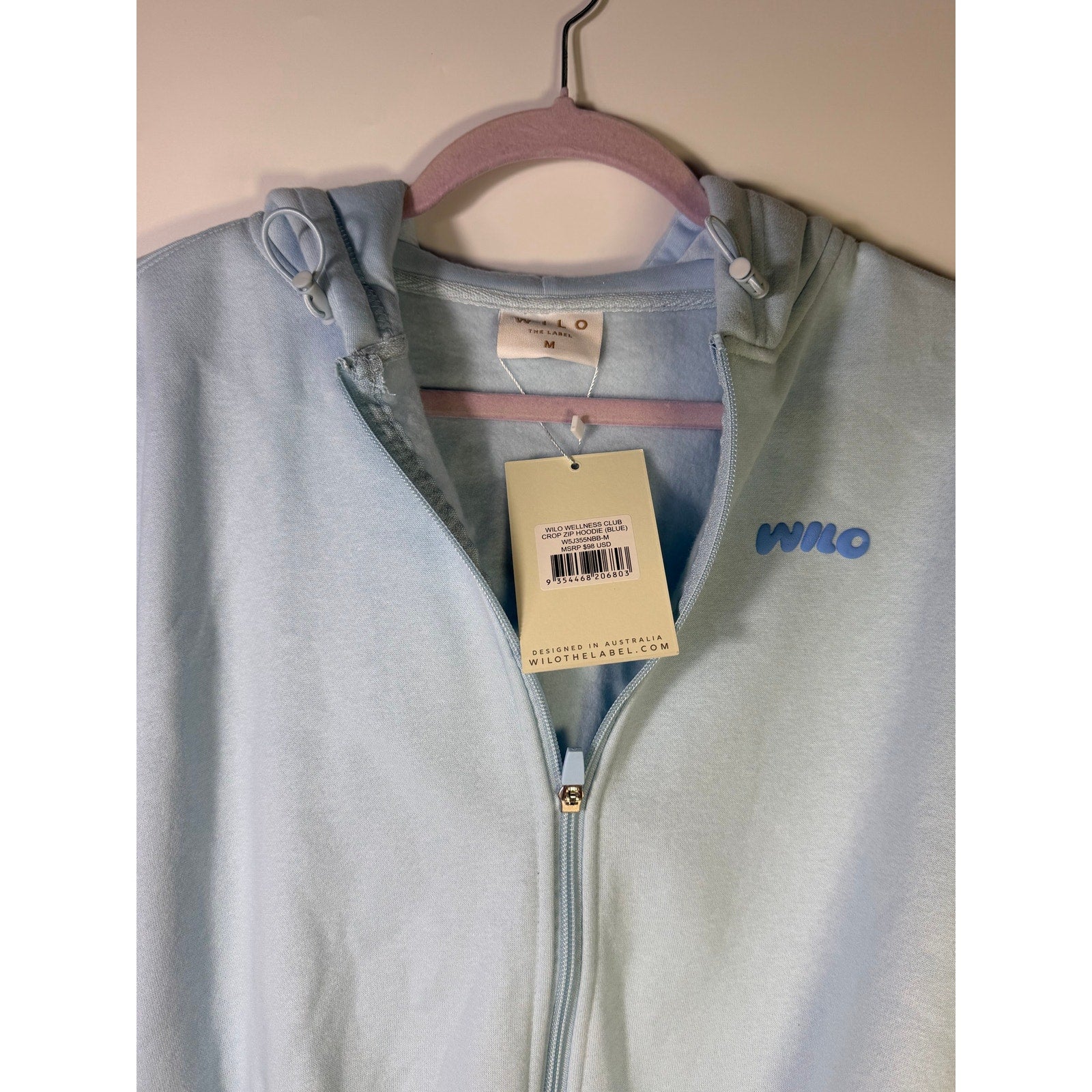 Blue Wilo The Label Wellness Club crop zip hoodie for women, size M, featuring a casual hoodie with a front zipper and relaxed fit.