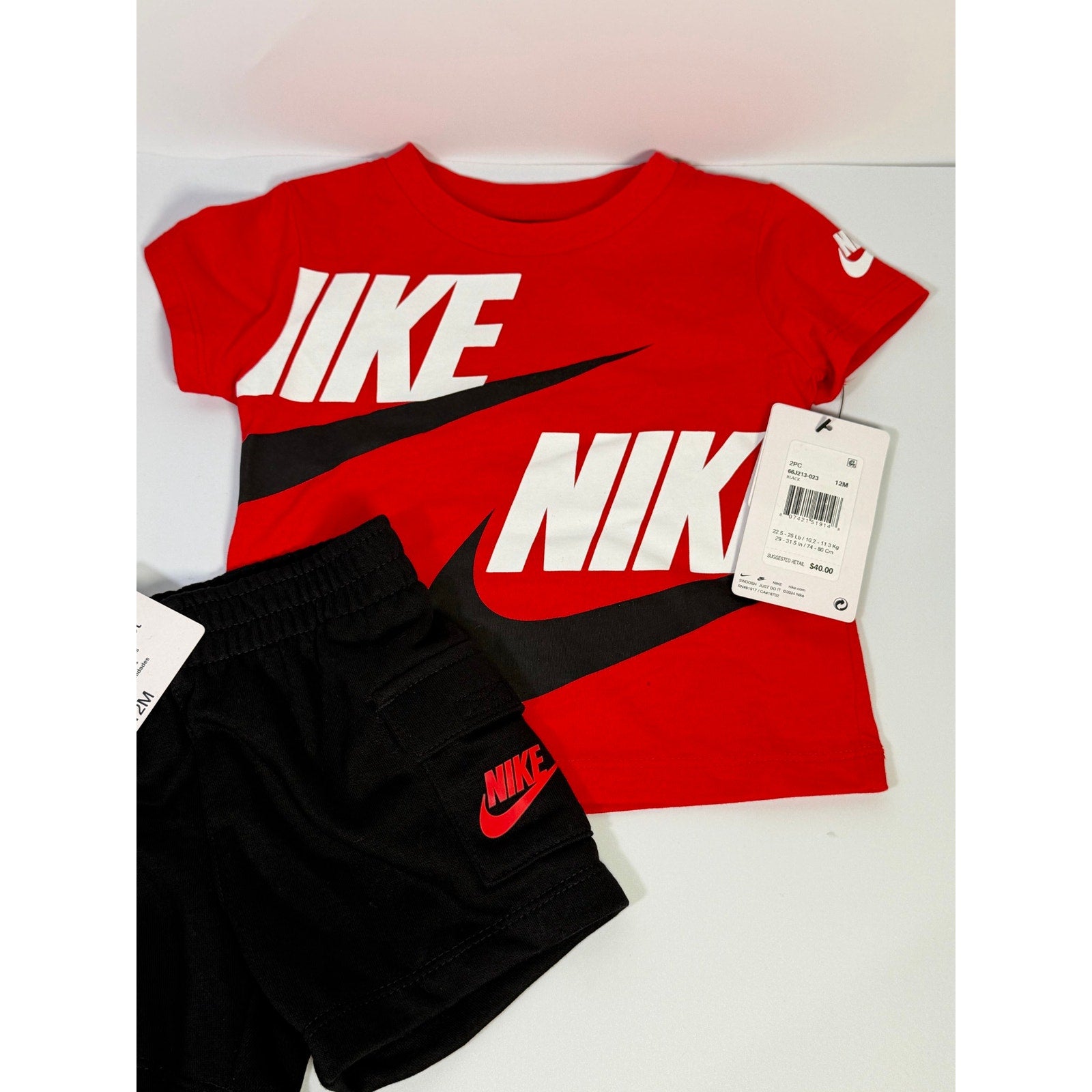 Nike baby boys 2-piece red and black t-shirt and shorts set, size 12 months, lightweight and comfortable clothing for infants.