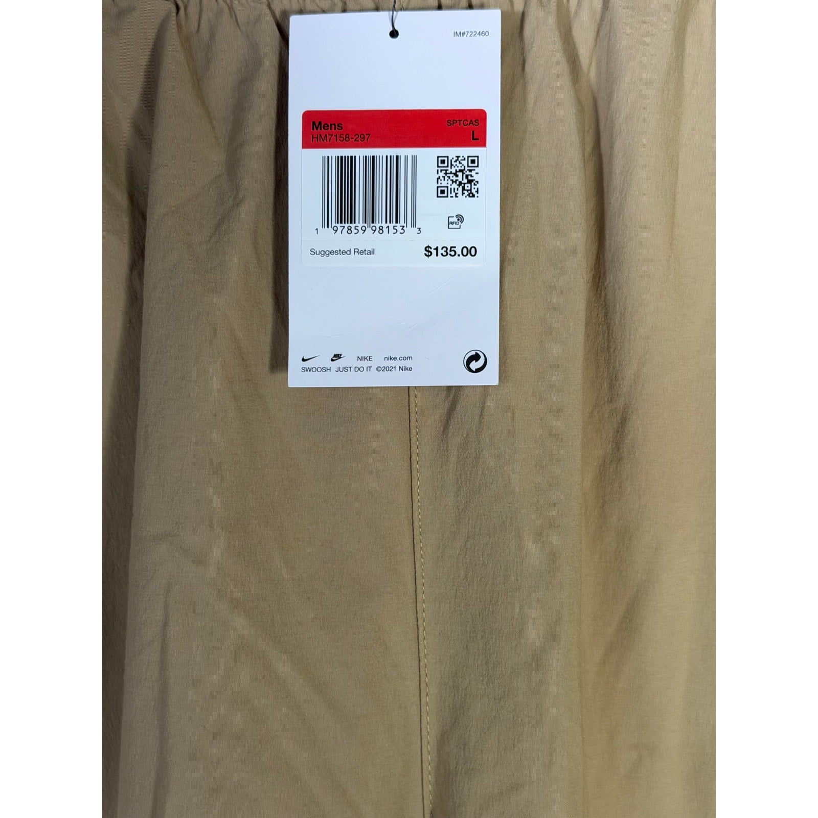 Nike Tech men's woven oversized parachute beige pants, size L, featuring a relaxed fit and lightweight fabric.