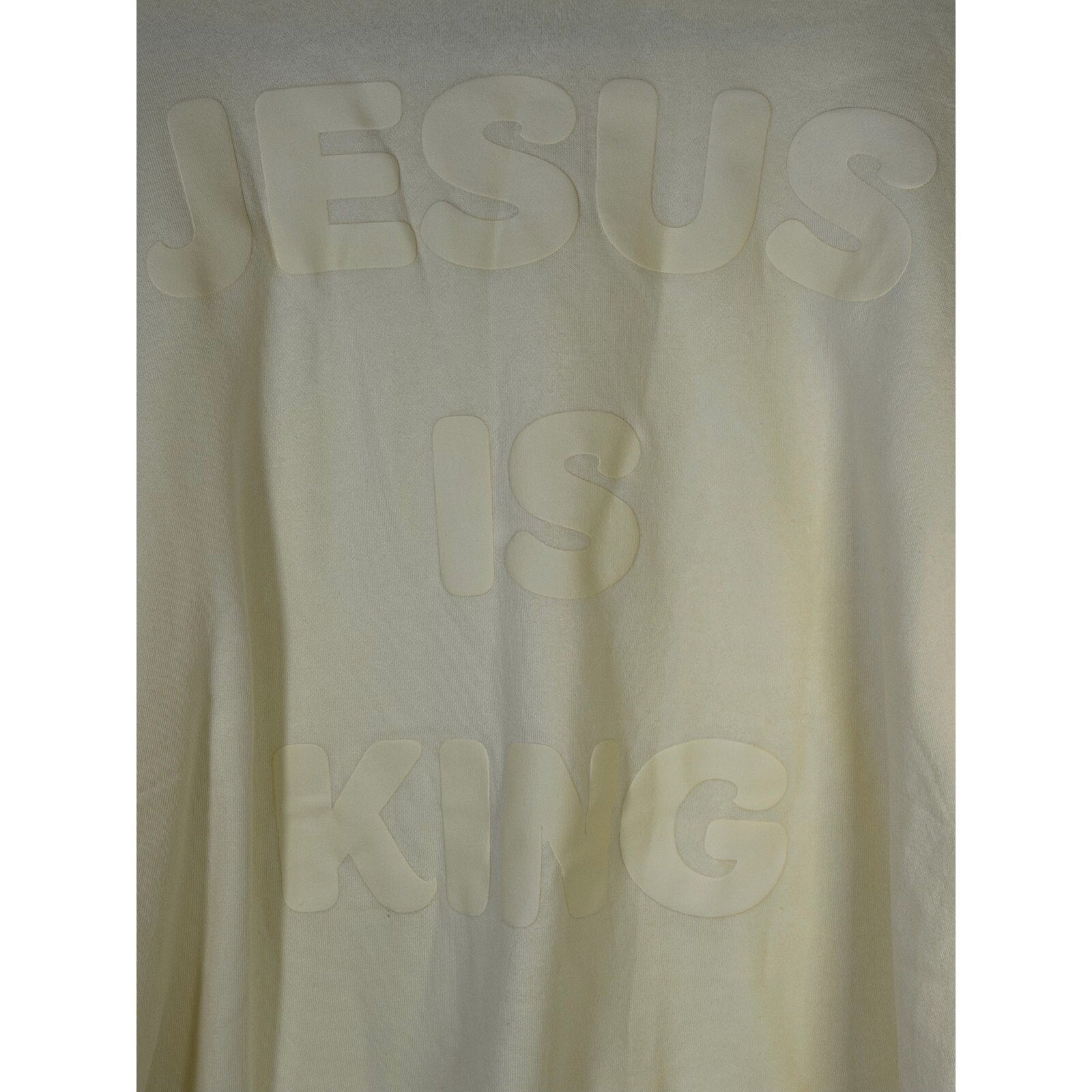 Yellow crewneck sweatshirt by Kind Regards with Revelation 19:16 Jesus is King printed on the front, size XL.
