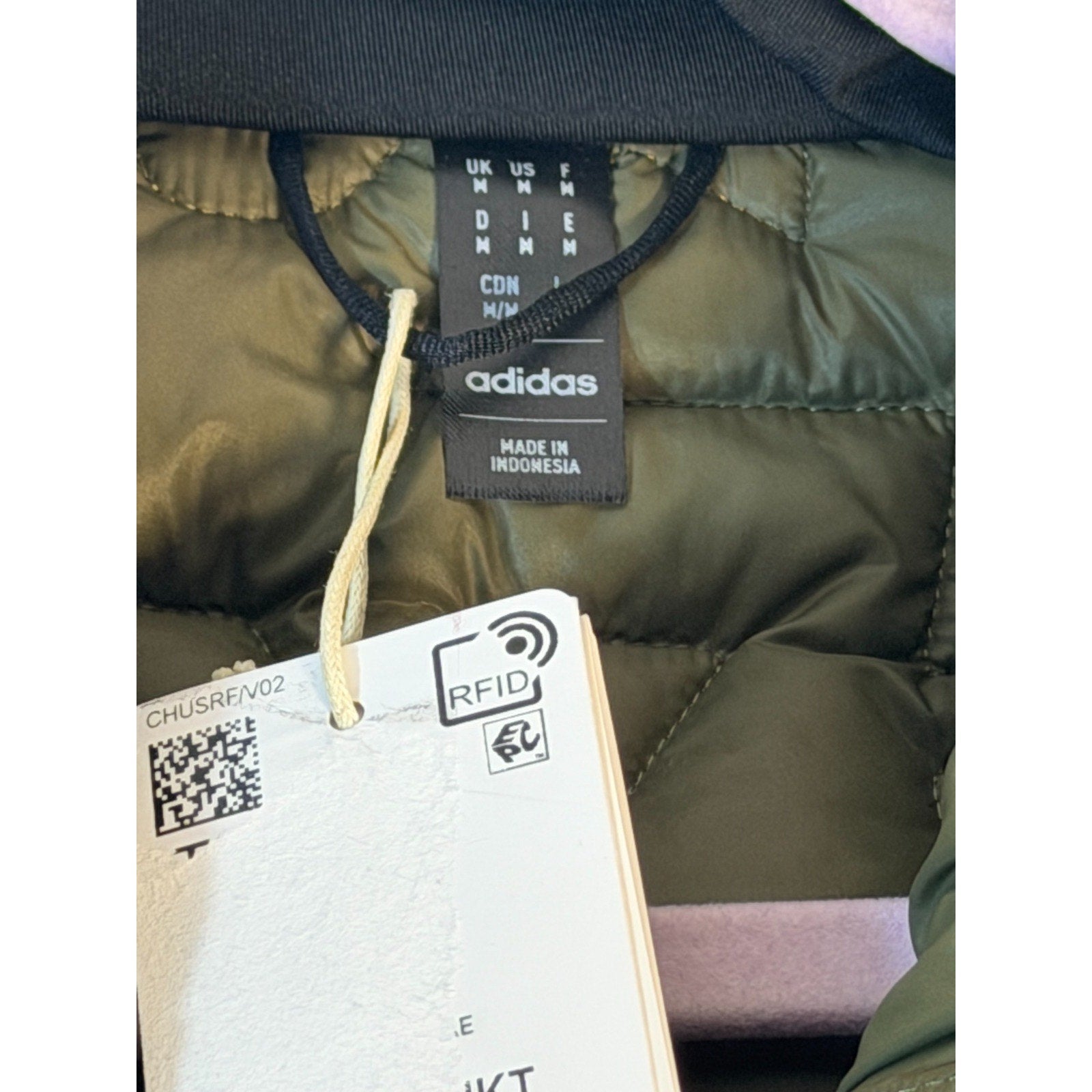 Men's Adidas Terrex insulated puffer jacket in olive green, medium size, featuring a quilted design and front zipper closure.