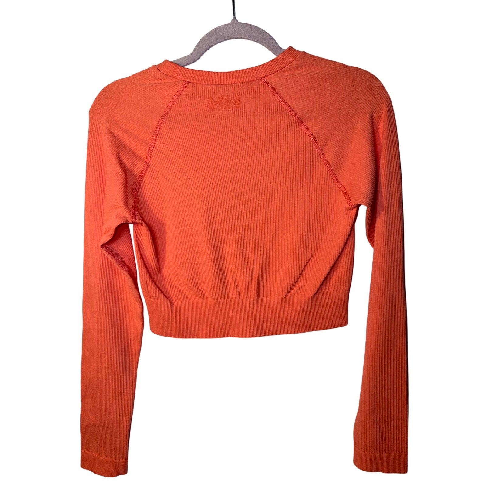 Helly Hansen youth long sleeve T-shirt in peach, size Large, featuring a comfortable fit and casual style for kids.