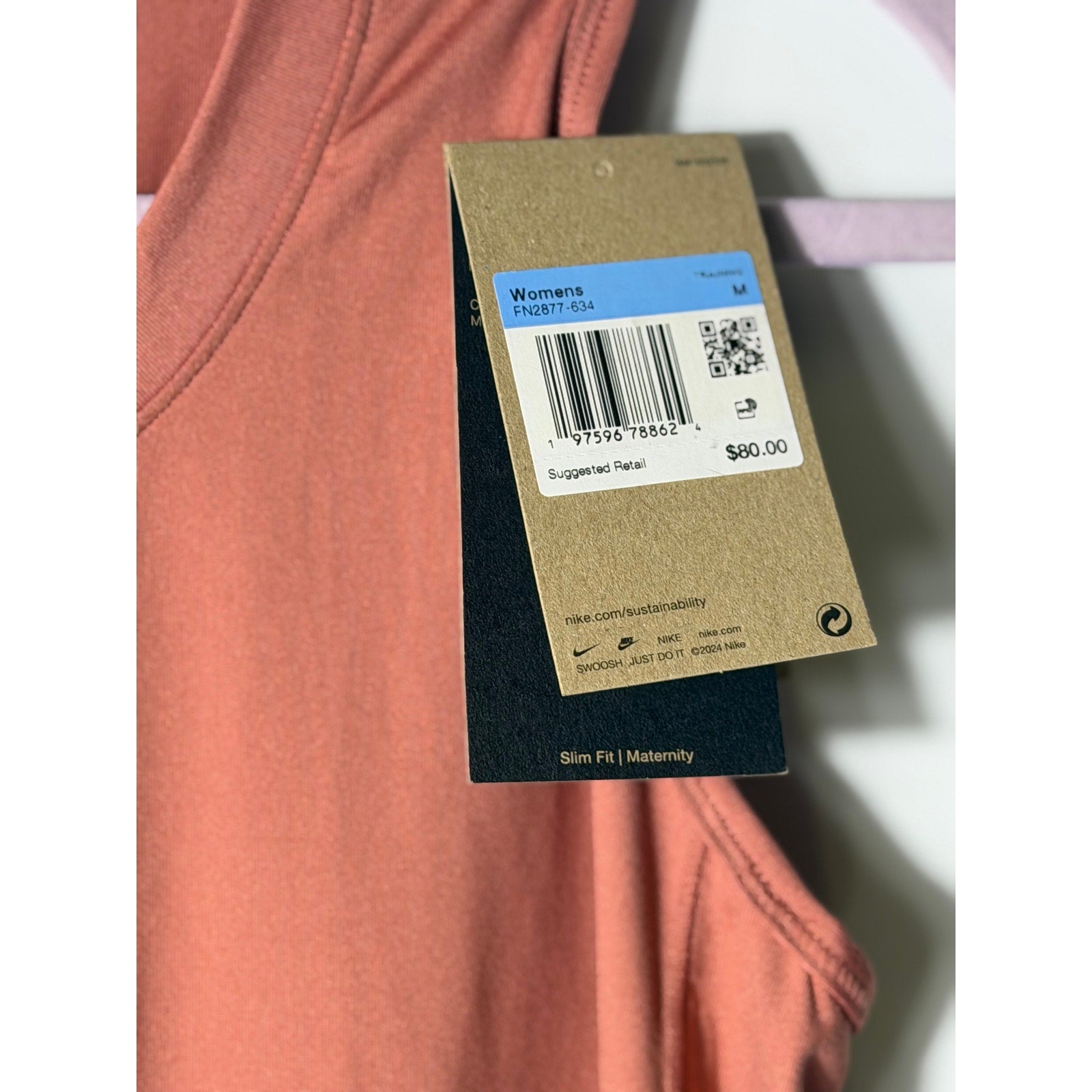 Nike Dri-FIT maternity sleeveless midi dress for women in pink, showing a comfortable, fitted design with a casual style.