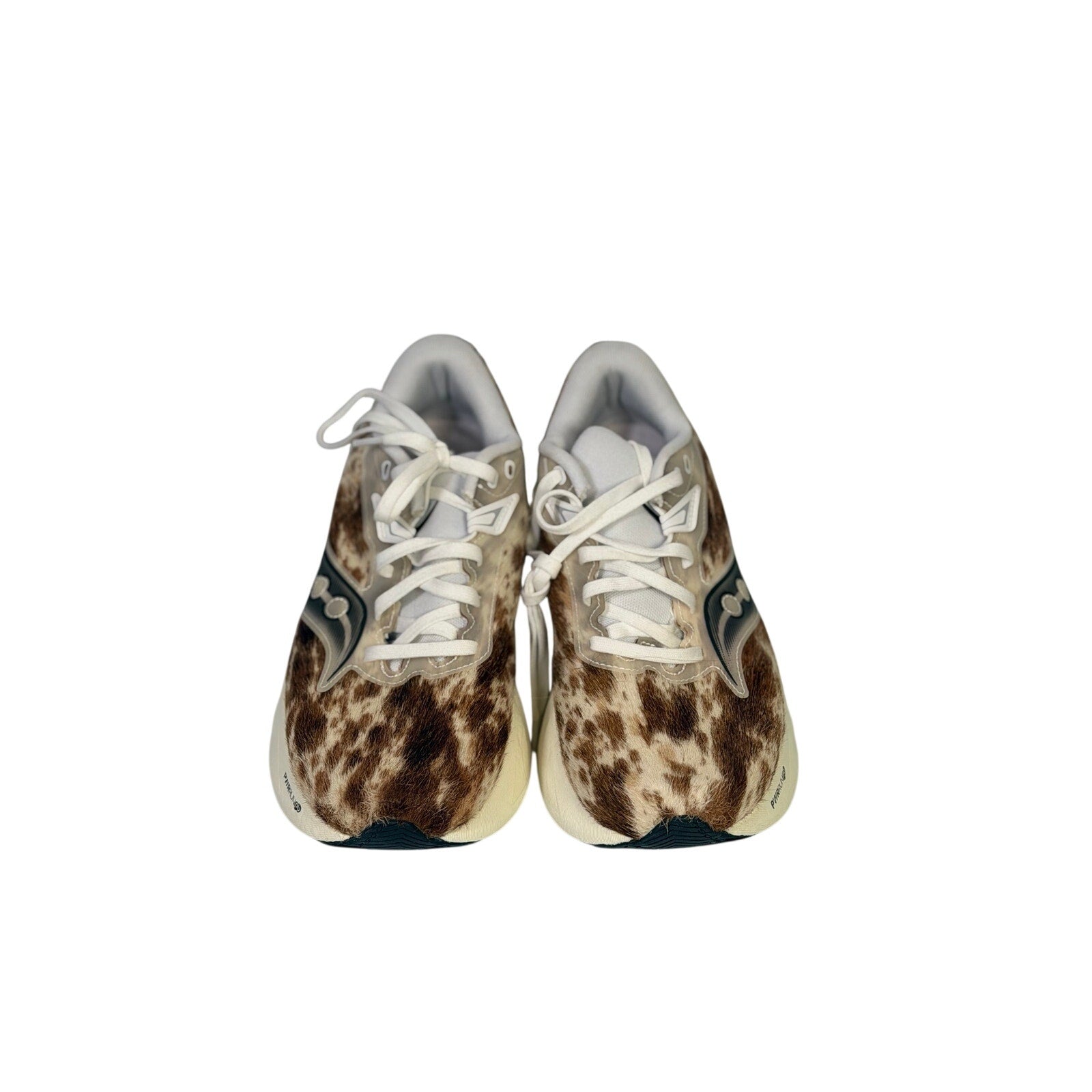Saucony Women's Endorphin Shift 3 Runshield cow print athletic running shoes, size 9, with black and white design and cushioned sole.