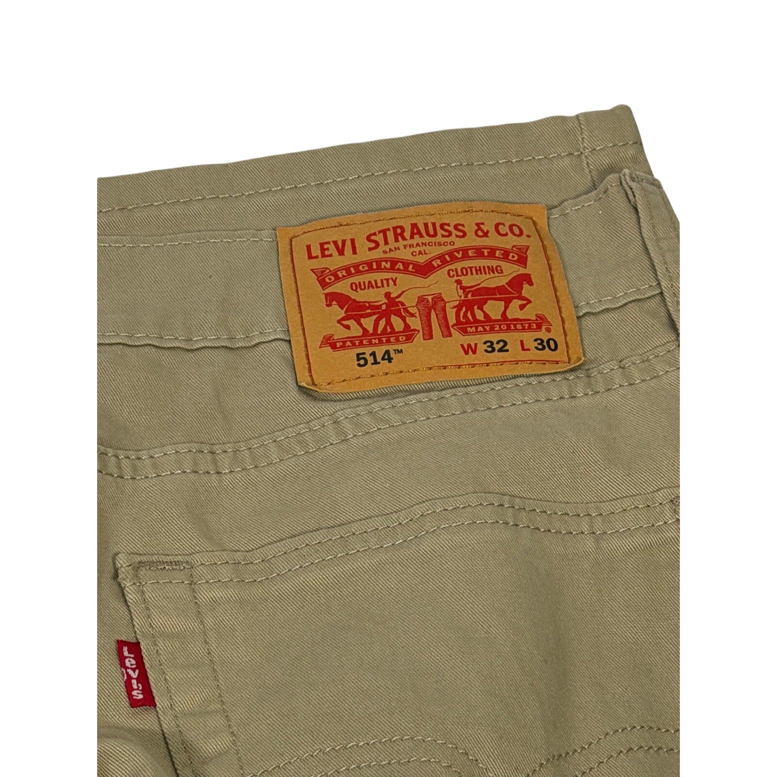 Levi's 514 men's straight fit stretch khaki pants in size 32x30 displayed flat, showcasing classic style and fabric texture.