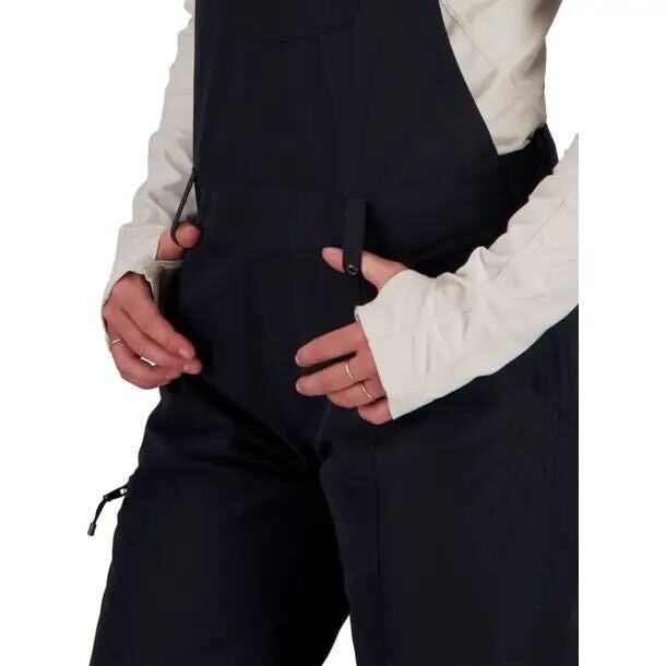 Obermeyer women's black insulated ski snow bib overalls, size 8, showing front view with adjustable straps and waterproof fabric.